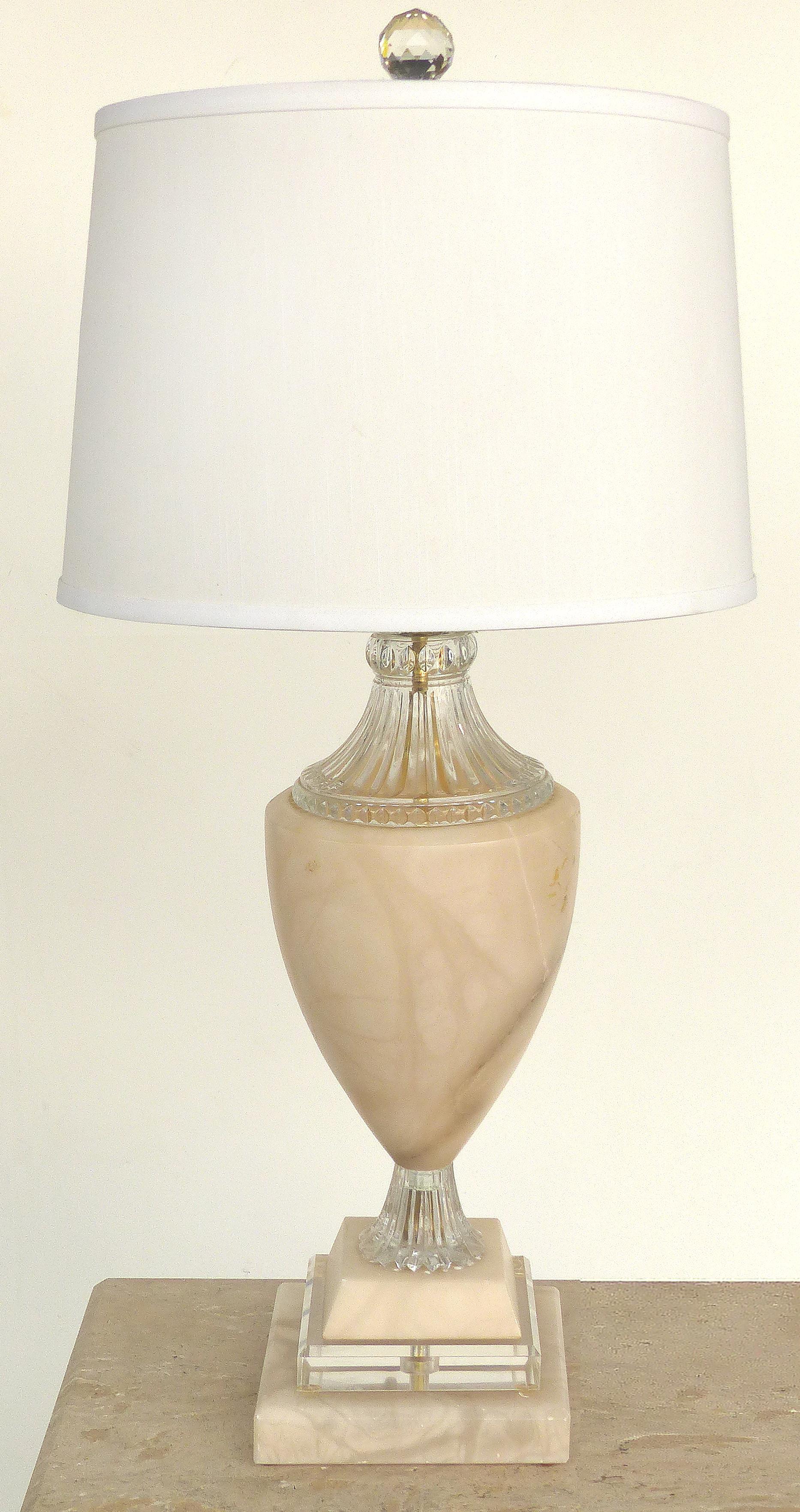 Traditional Alabaster Urn Form Table Lamps with Glass and Crystal Accents, Pair

Offered for sale is a stately pair of urn form alabaster table lamps with cut and pressed glass accents. Each lamp is topped with faceted crystal finials. The alabaster