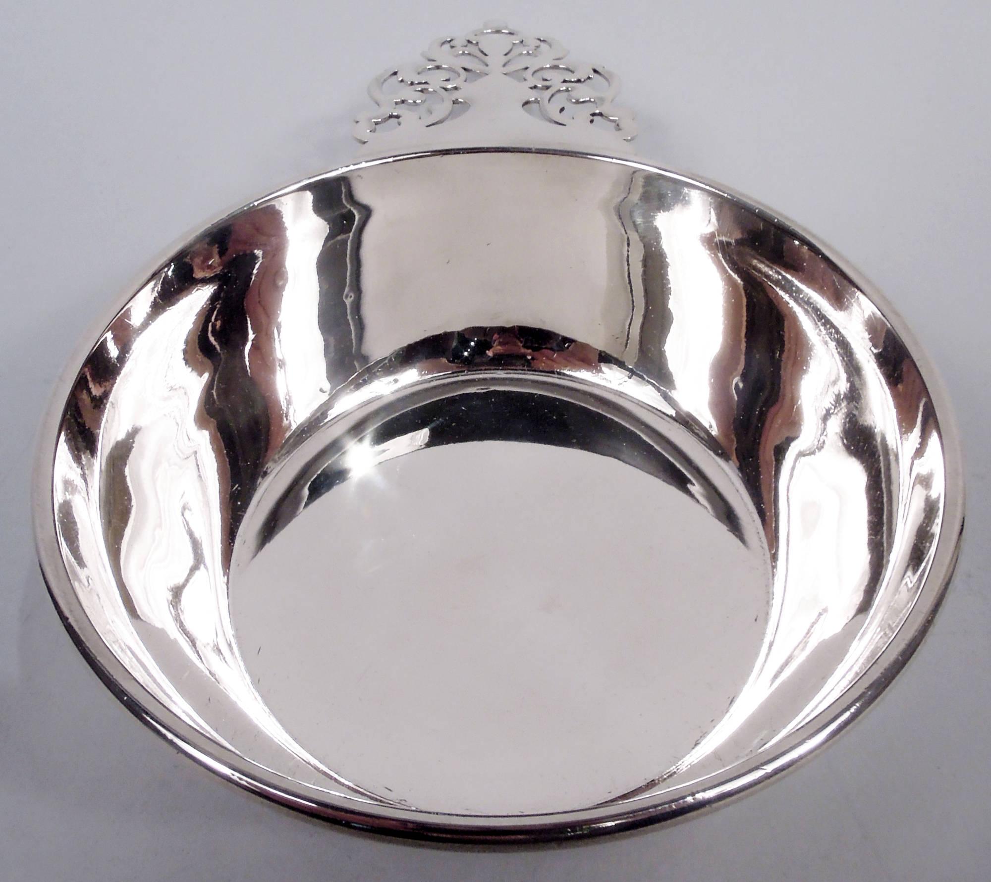 Traditional America Colonial sterling silver porringer. Made by Baldwin & Miller in Newark. Curved and tapering sides and open tree handle. Lots of room for engraving. Fully marked including maker’s stamp and no. 60. Weight: 5 troy ounces.  