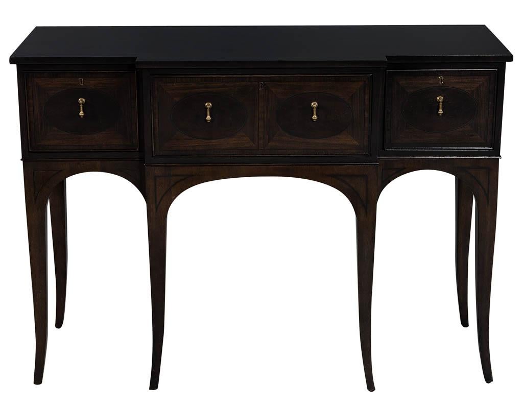 Traditional American mahogany inlaid console tables. Original design and look with beautiful inlaid work and slender curved legs. This piece is perfect the console or sideboard for a condo dining room or hallway.
Price includes complimentary curb