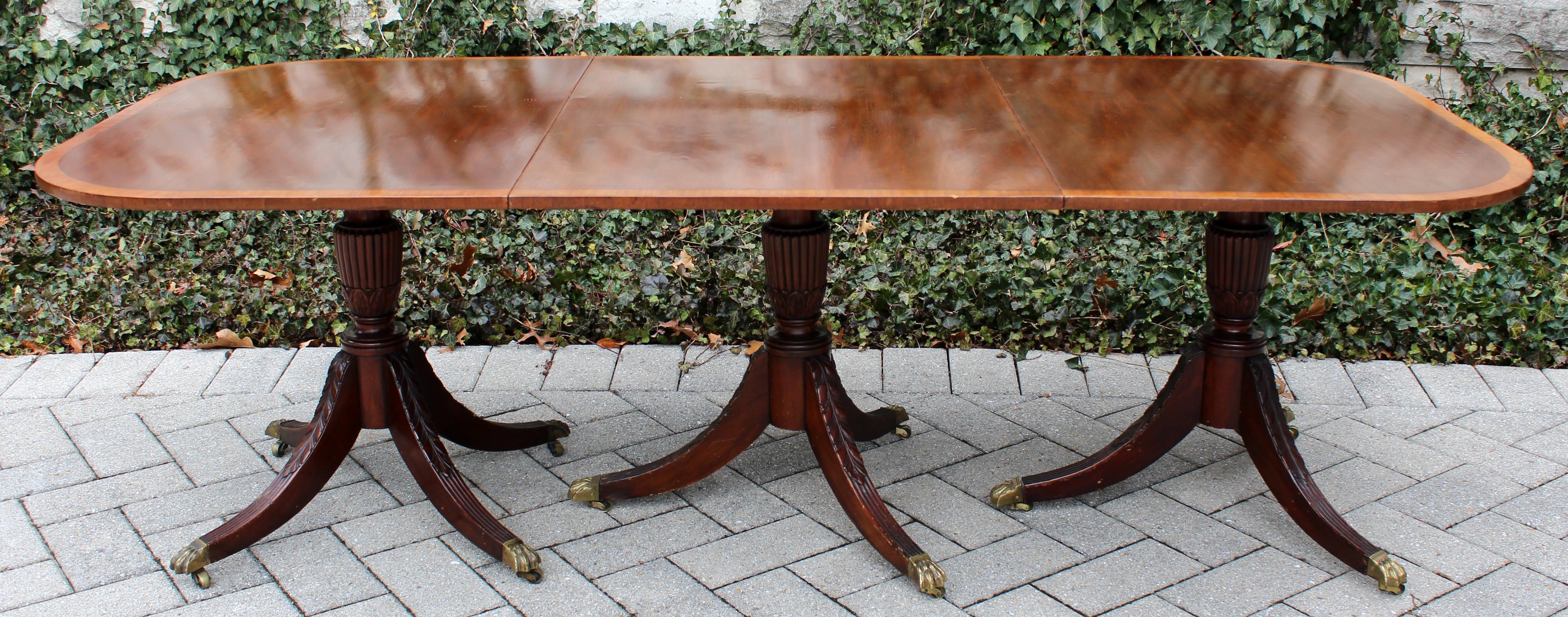 For your consideration is a magnificent, traditional antique Duncan Fife style, expandable mahogany dining table brass claw foot in very good vintage condition. The dimensions are 93