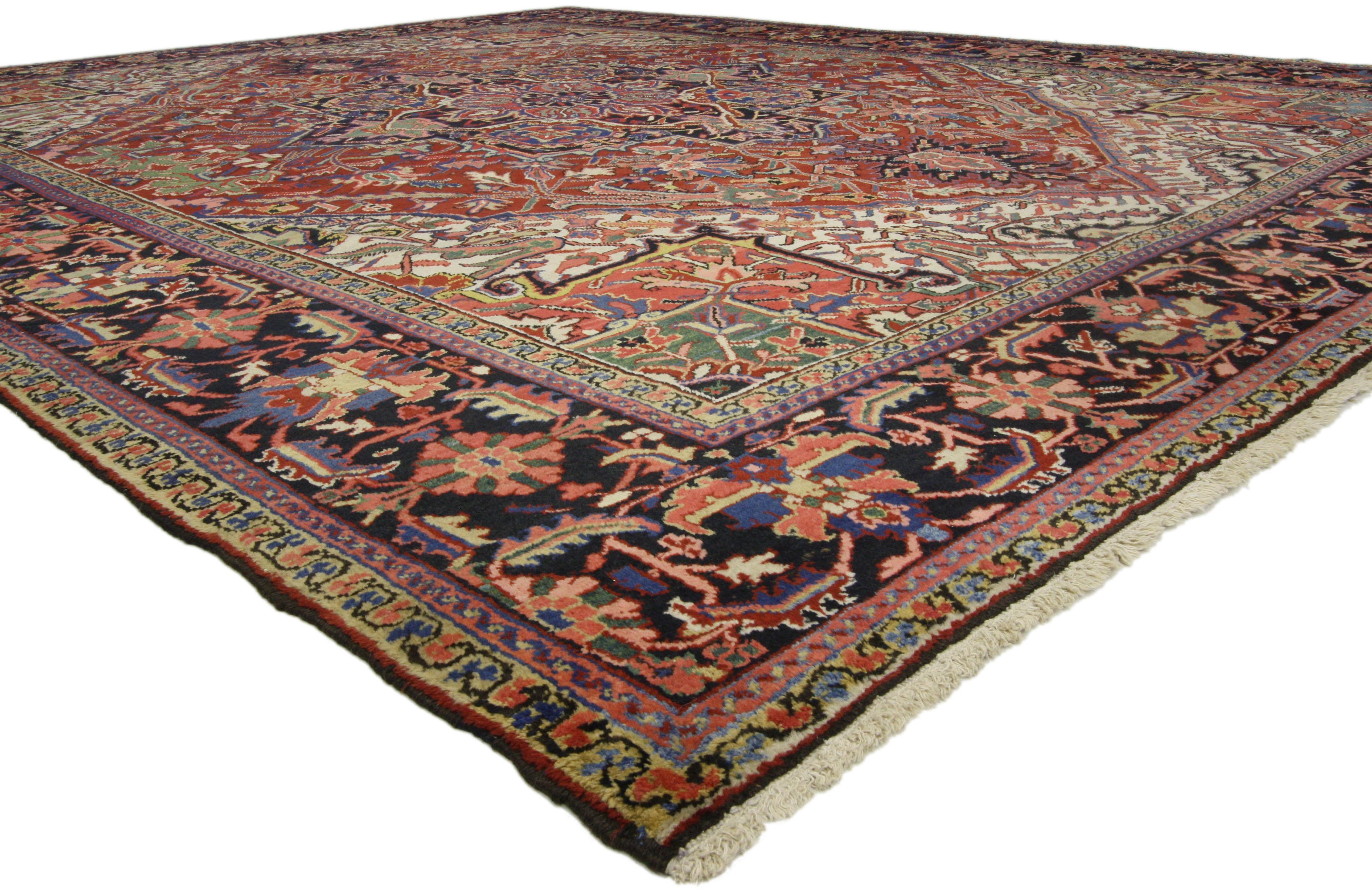 76651, traditional antique Persian Heriz rug with English Country style Manor House. This hand knotted wool antique Persian Heriz rug features a large octofoil medallion with palmette pendants floating in the center of an abrashed brick red field.
