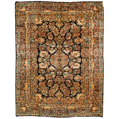Traditional Antique Persian Sarouk Rug with Dark Blue Field and a Floral Pattern