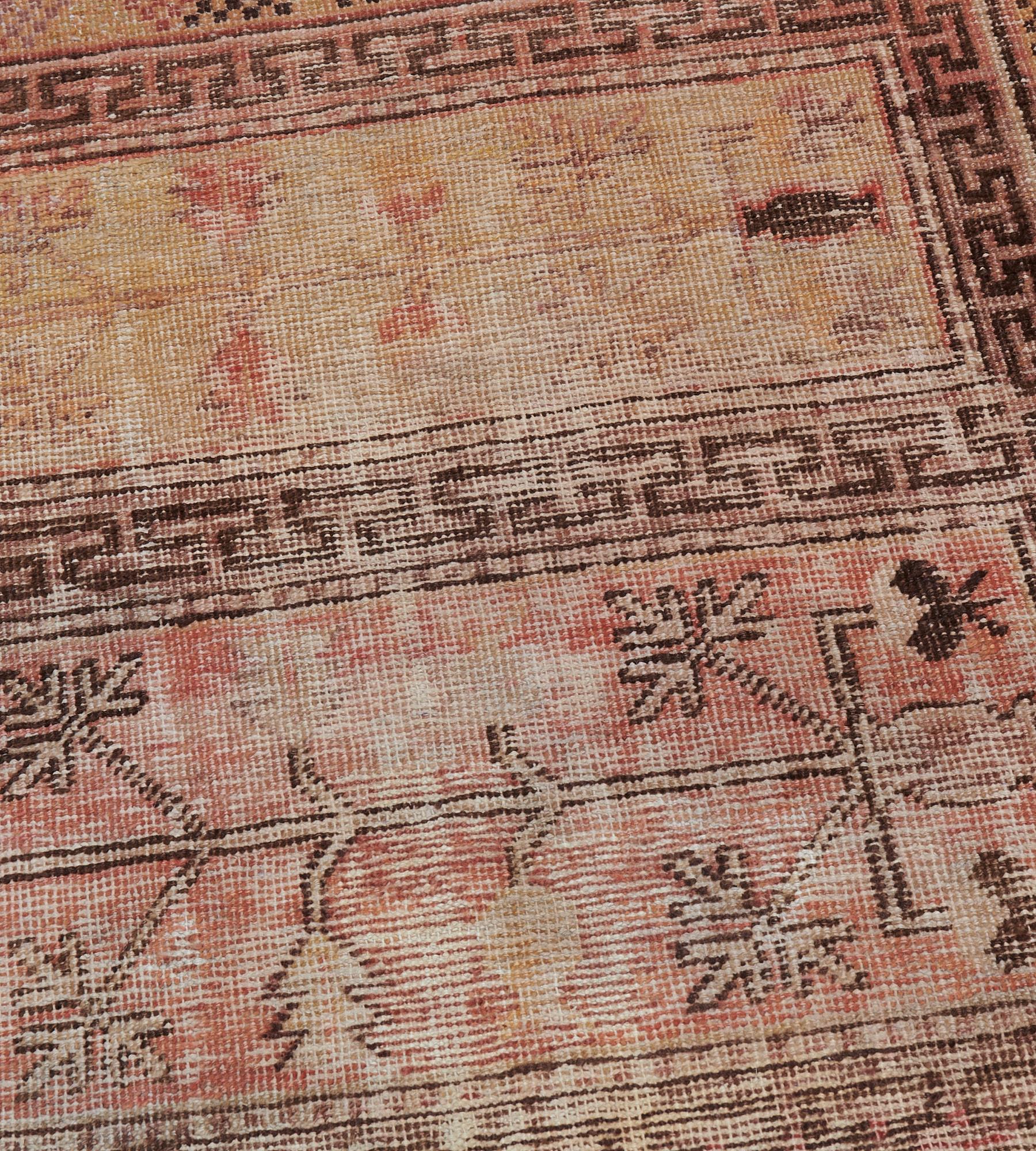 Tapis traditionnel Khotan en laine ancienne 3'4