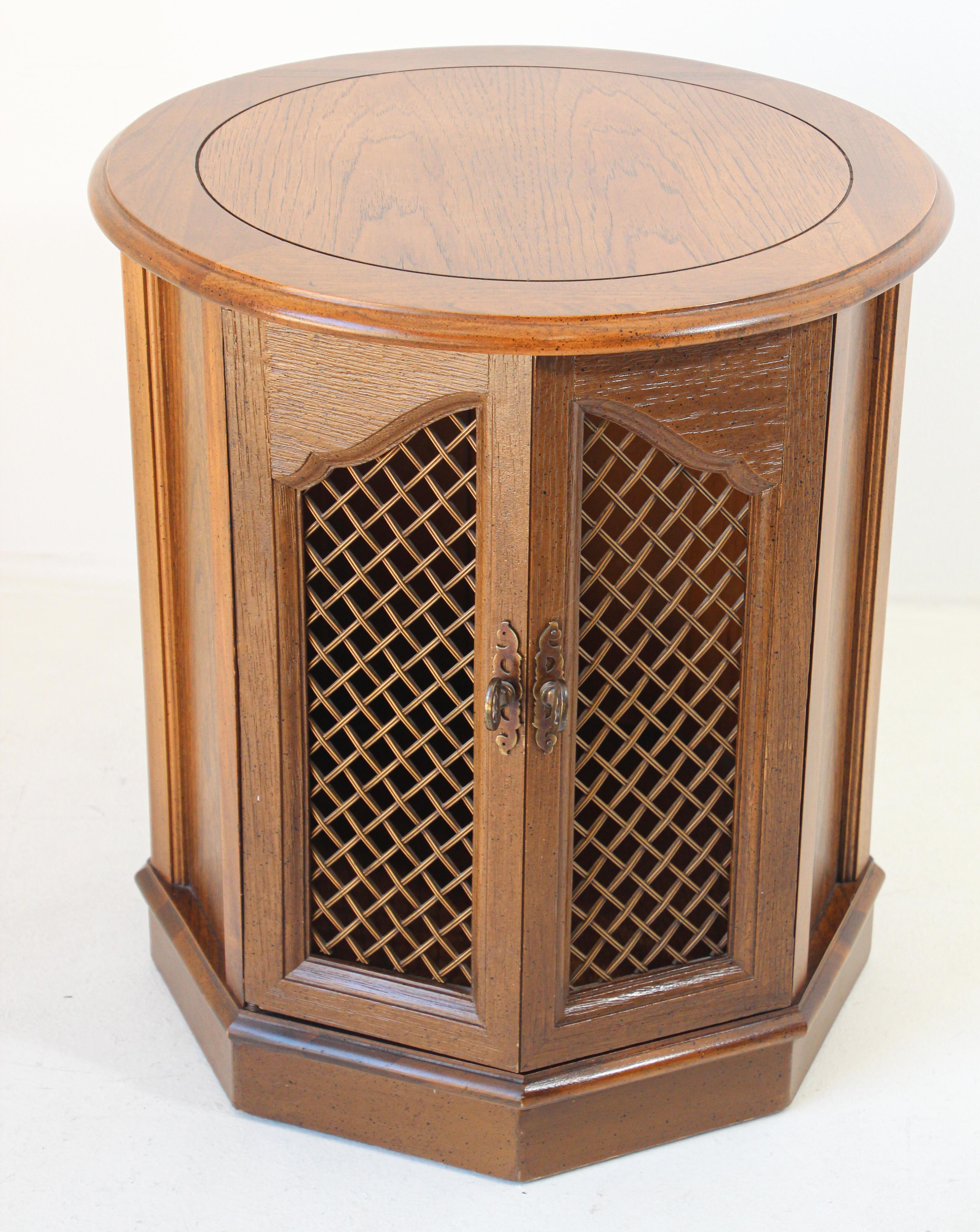 Traditional Barker Bros accent side table cabinet
20th century traditional Barker Bros Moorish collection accent end table
Quality hardwood side table cabinet with storage featuring fret work door and moorish arches.
Solid and sturdy nice rich oak