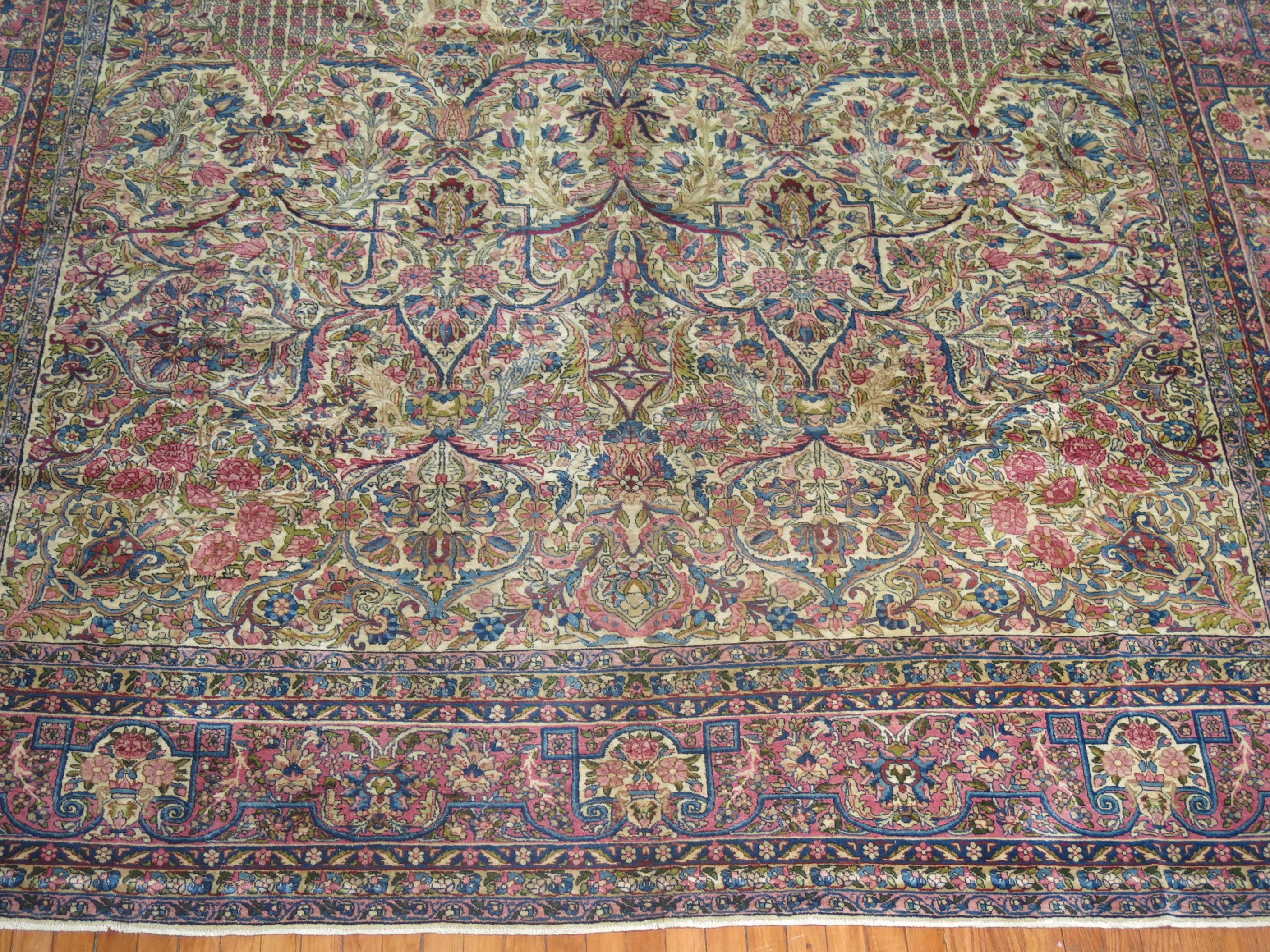 An early 20th-century Persian Kerman traditional room size rug.

Measures: 9'9'' x 13'11''.

The province and city of Kerman in Central Persia continued to make extraordinary carpets throughout the 19th century and turn of the 20th century.