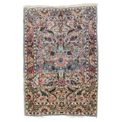 Tapis traditionnel Kerman classique bleu et rose