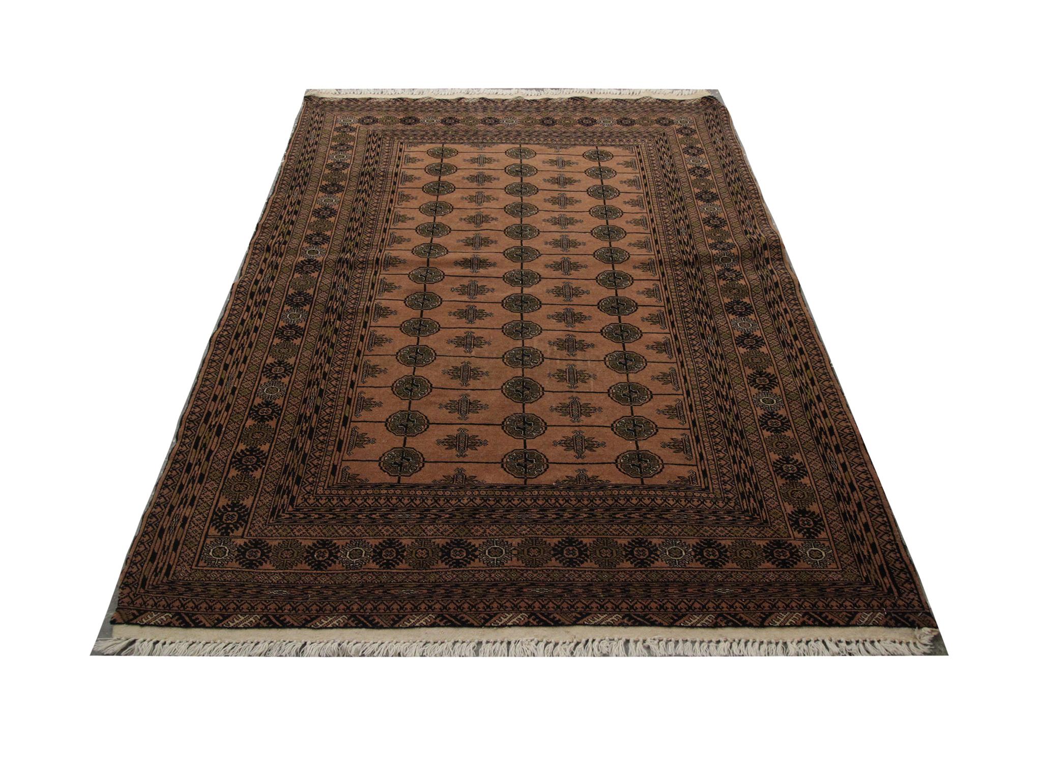 Handmade carpet Oriental rug minimal colors have been used in this Traditional Bokhara rug, brown is the main featured color with three rows of black octagonal motifs as the central design. This is supported by a highly-detailed multi-layered