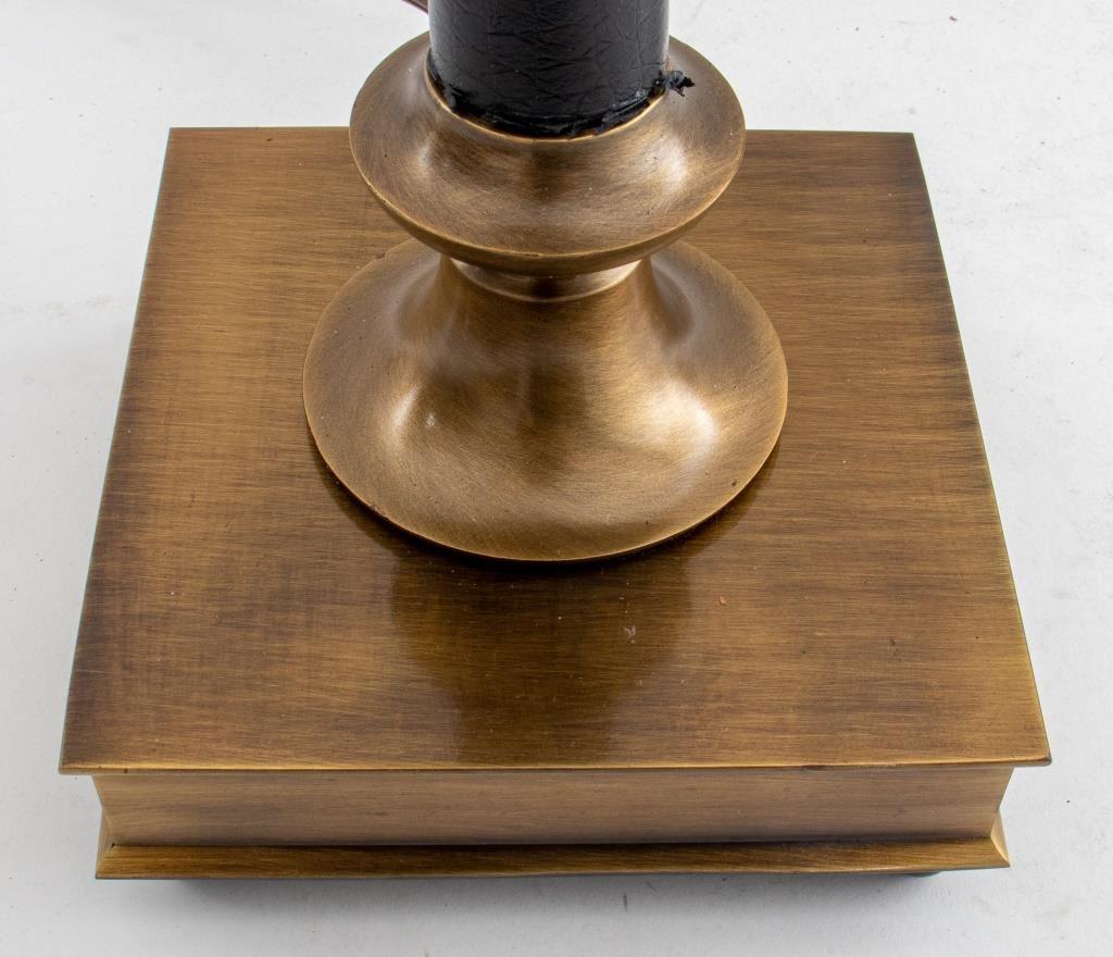 Traditional brass and black vegan leather table lamp, outfitted with a mircrosun attachment, with an American plug. 