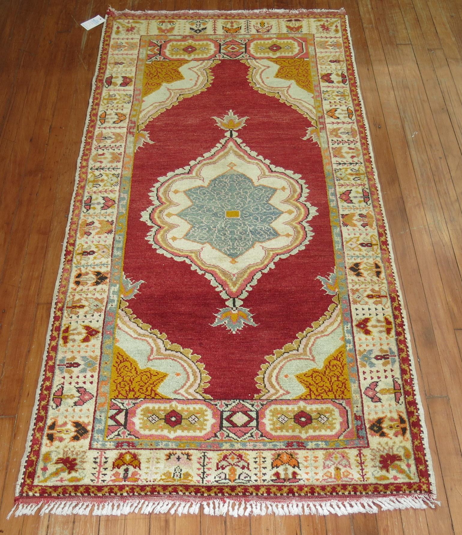 Vintage Turkish Oushak runner with a medallion and border design on a bright red field.

Measures: 3'5