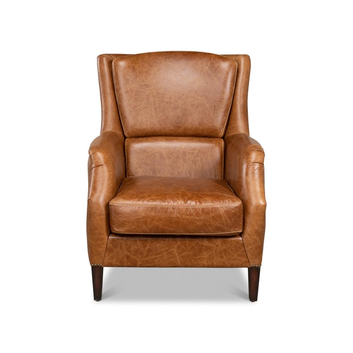 Ein traditioneller brauner Ledersessel mit Nagelkopfverzierungen. Dieser klassische Stuhl ist aus reinem Anilinleder in der Farbe Kuba braun gefertigt.

Abmessungen: 30