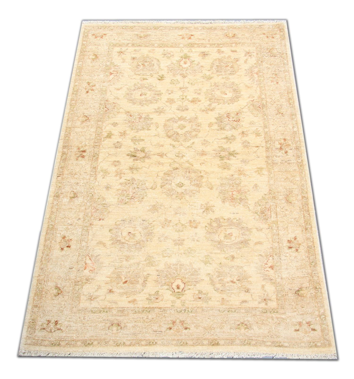 This traditional Ziegler rug is one of our more luxurious rugs made on looms by master weavers of Afghan rugs. This cream rug is made with or all handspun wool, with the colour coming from organic vegetable dyes. This carpet features an all-over