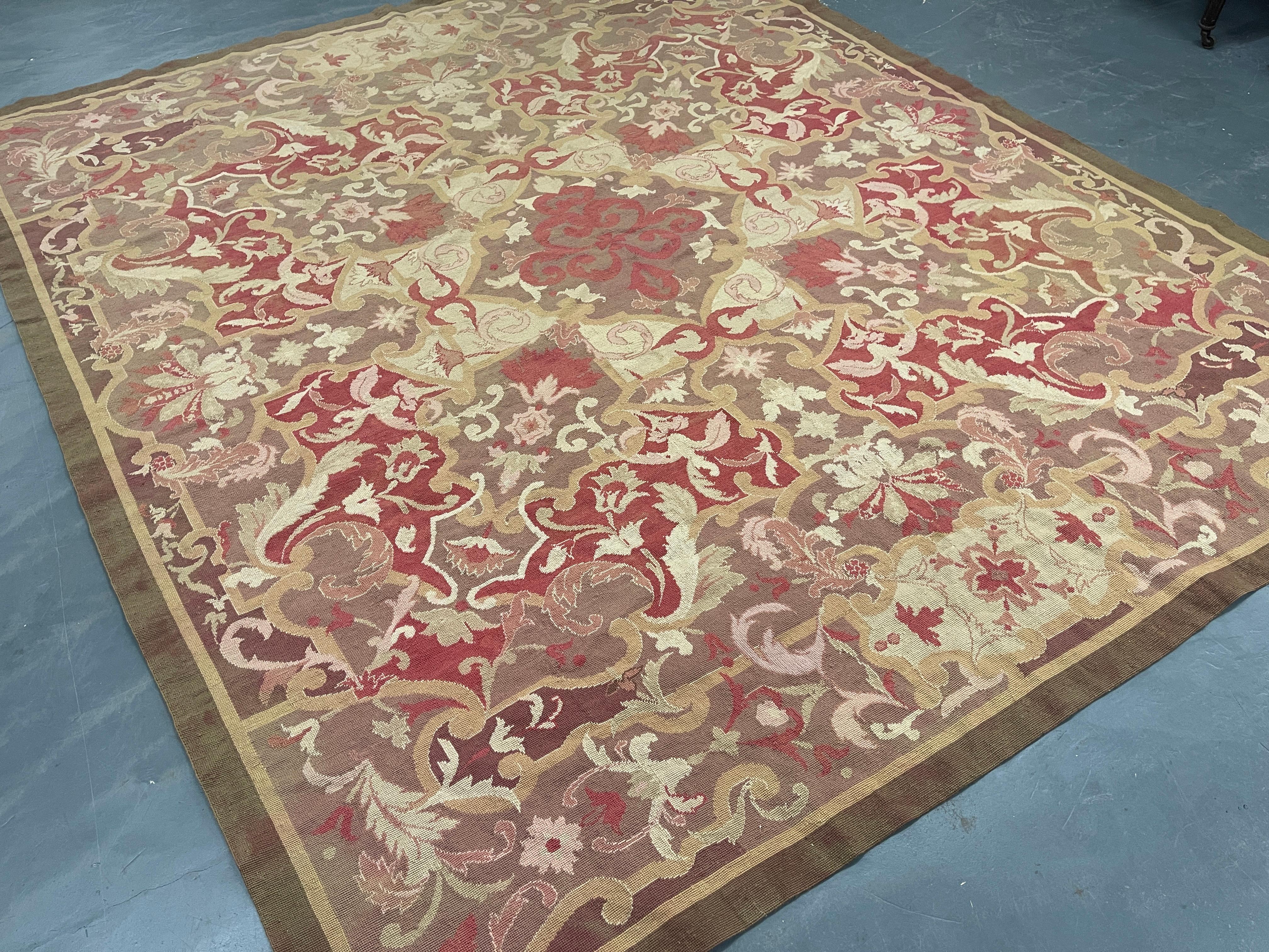 This fantastic square area rug has been handwoven with a beautiful symmetrical floral design woven on a pink background with brown, green, and ivory accents. This elegant piece's colour and design make it the perfect accent rug.
This style of rugs