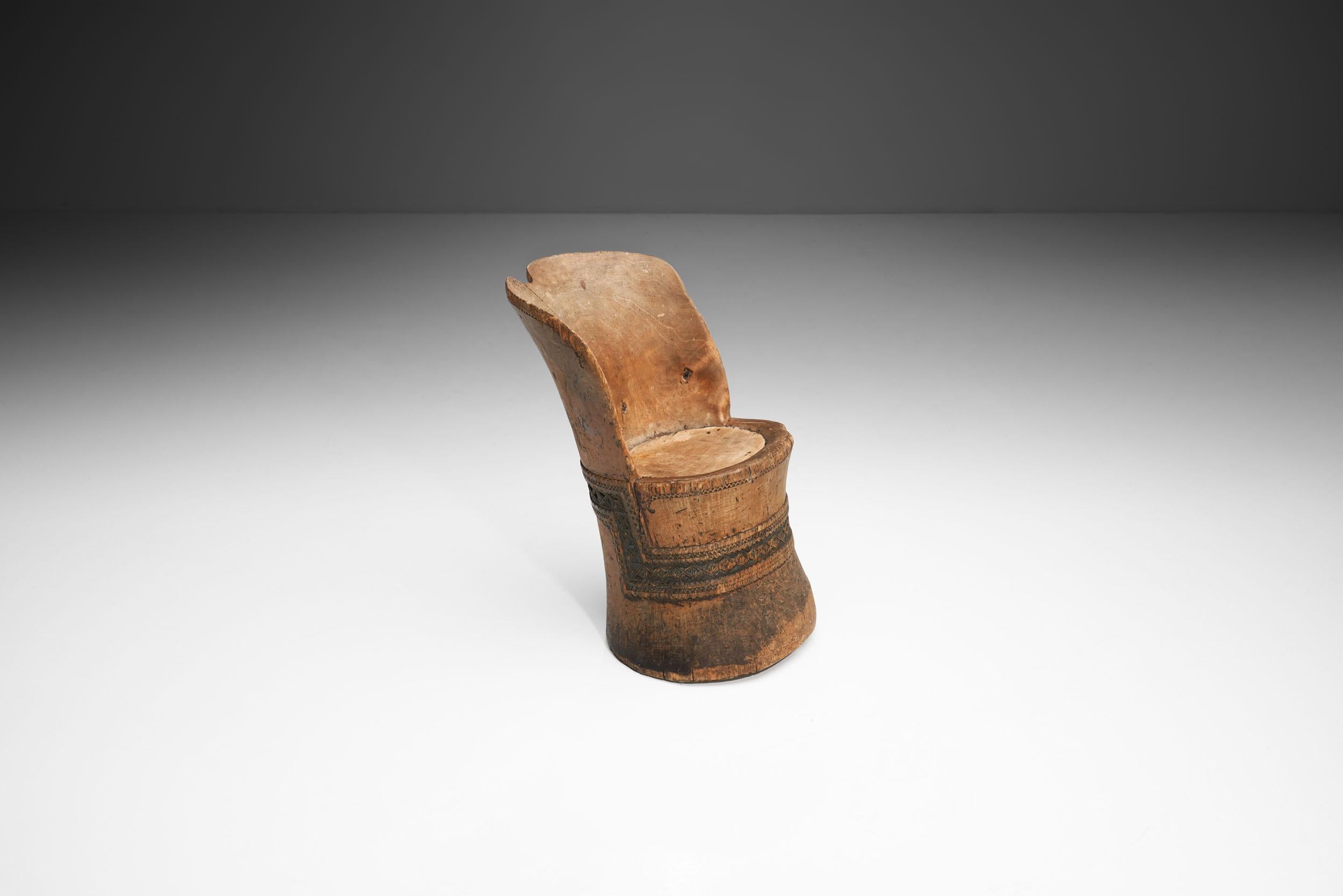 This “kubbstol” or “kubbestol” is a traditional Scandinavian chair made from a log. The kubbestol was quite common in some districts of Norway from about 1750 to 1960, where it was usually made from logs with significant girth and three to four feet