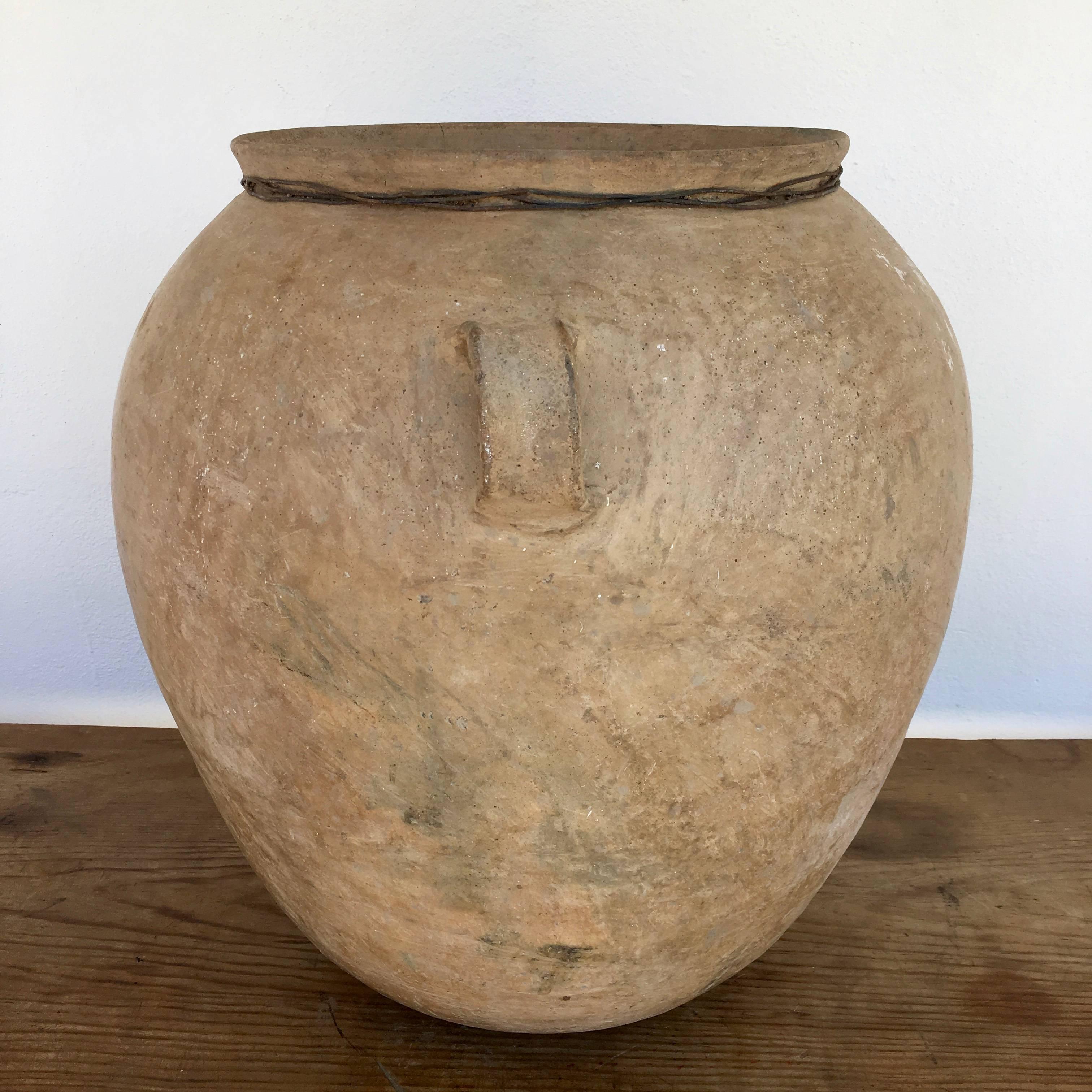 Smooth burnished patina. Large black fire mark on one side with smaller white markings on one face. Beautifully elaborated 1970s water vessel from the Popoloca cultural region of Puebla. The rural and remote communities that once practiced this art