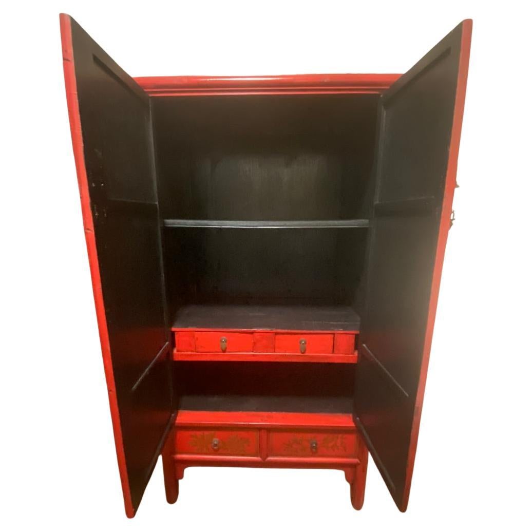20th Century Traditional Chinese Red Wardrobe Cabinet with Gold Chinese Calligraphy For Sale