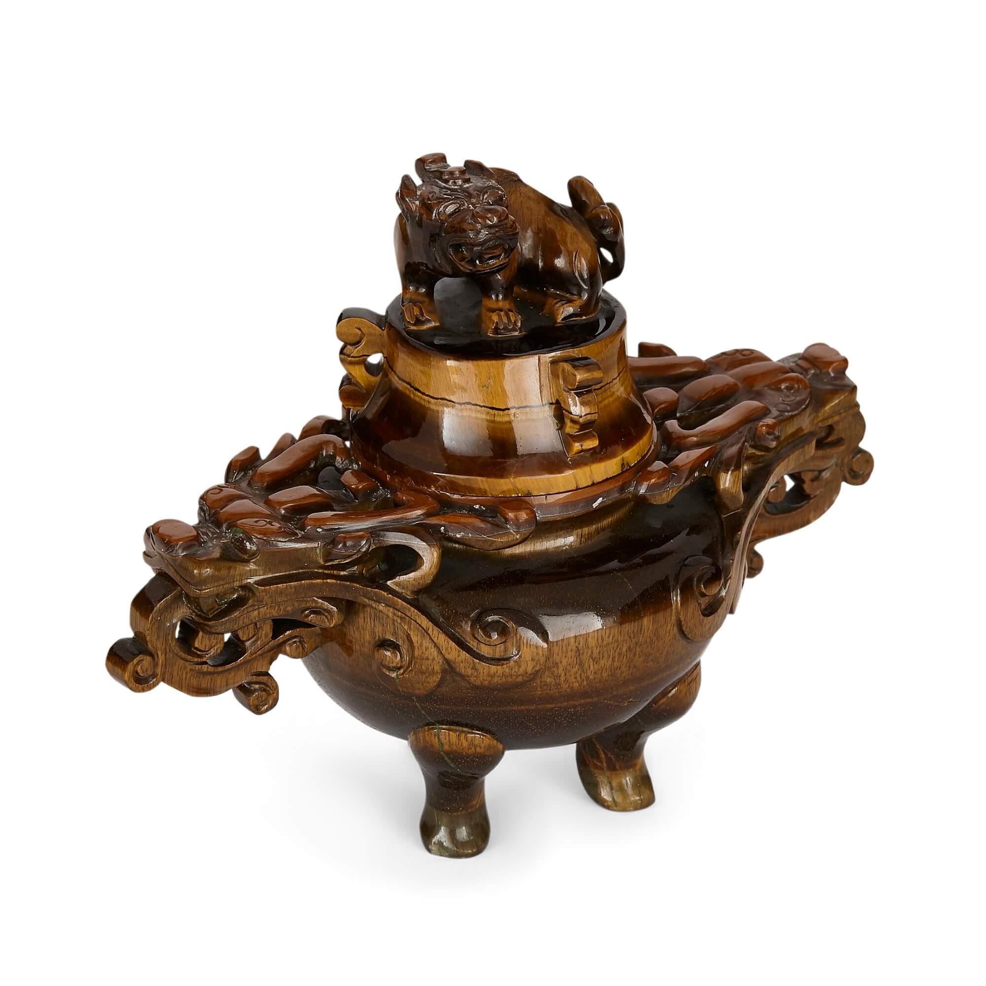 Traditional Chinese vase carved from tiger's eye
Chinese, early 20th century
Measures: Height 13cm, width 17cm, depth 9cm

This wonderful vase is crafted in a traditional Chinese style from tiger’s eye, a lustrous golden-brown stone. The vase