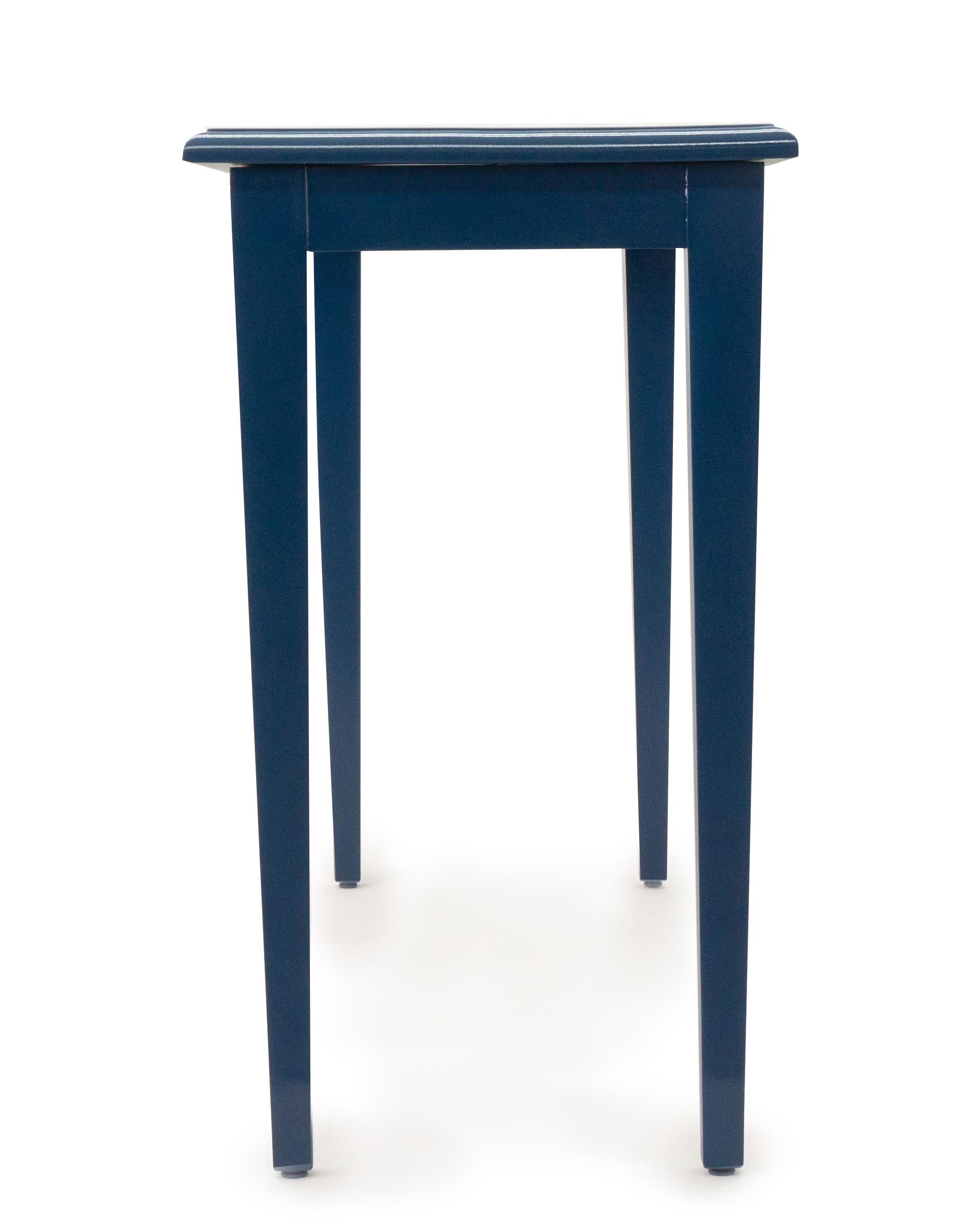 Newly painted console table lacquered in a California blue with tapered legs. 

Customizable sizes and finishes upon request. 

Measurements: 35