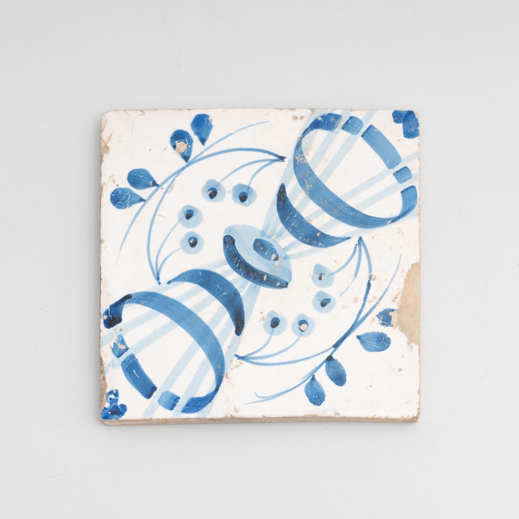 Traditional Spanish decorative ceramic tile. Made in the iconic designs of Catalan Modernism.    Manufactured by unknown artist in Spain, circa 1940.    Materials:  Ceramic    In good original condition, with minor wear consistent with age and use,
