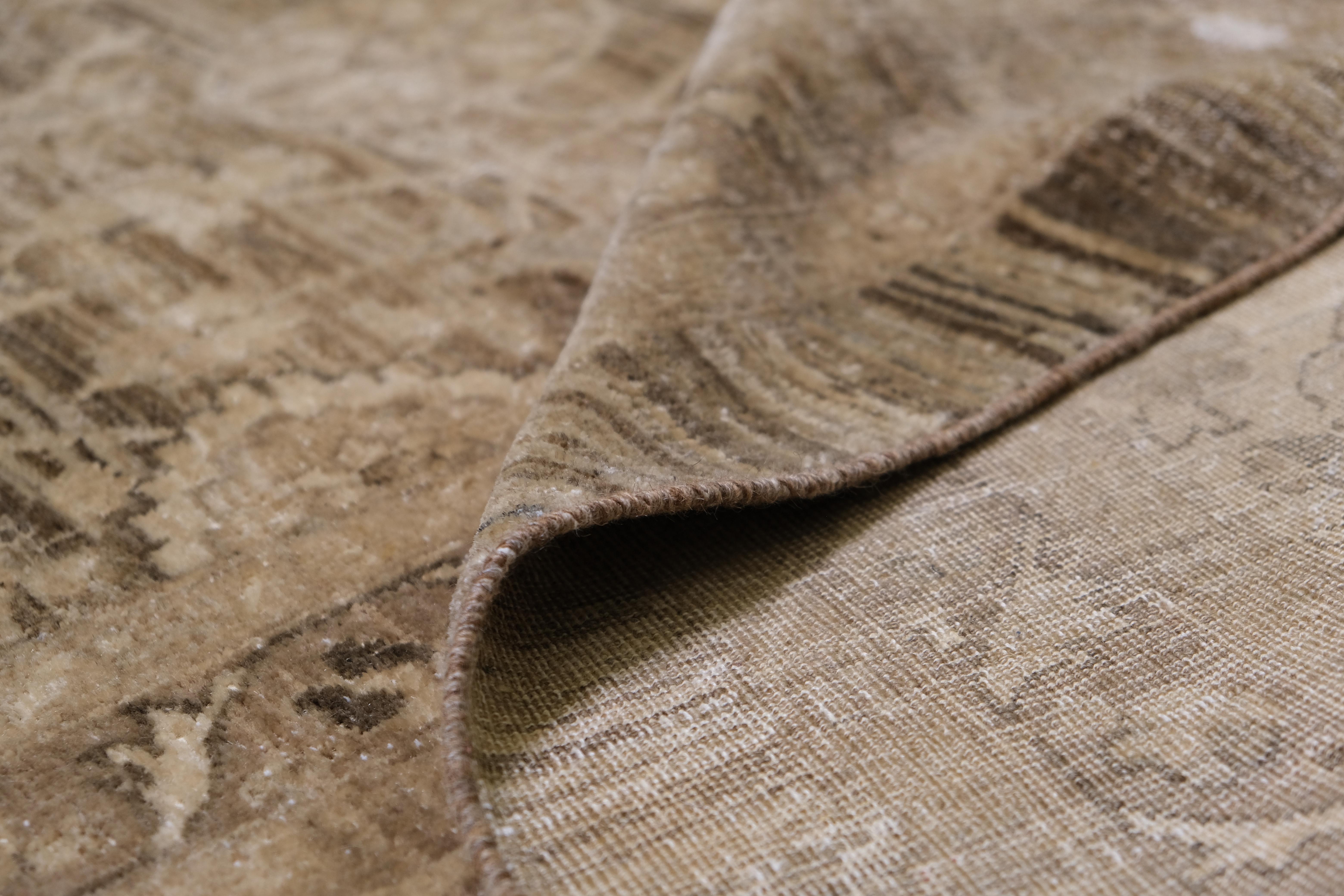 Discover the elegance of this hand-knotted wool rug, a timeless piece that combines vintage-inspired design with exceptional craftsmanship. Measuring 11'5