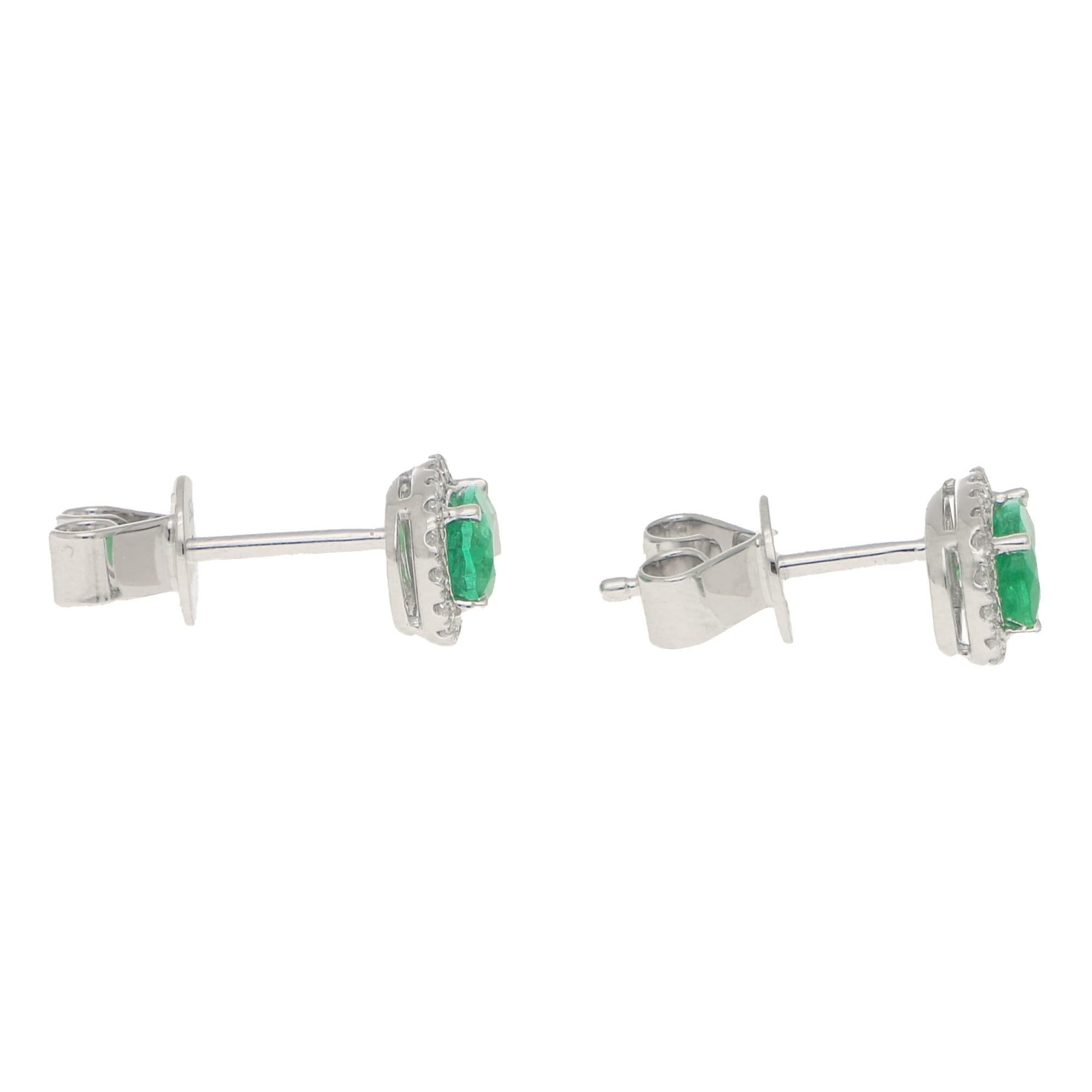 Traditional Emerald and Diamond Cluster Earrings in 18 Karat White Gold In Good Condition In London, GB