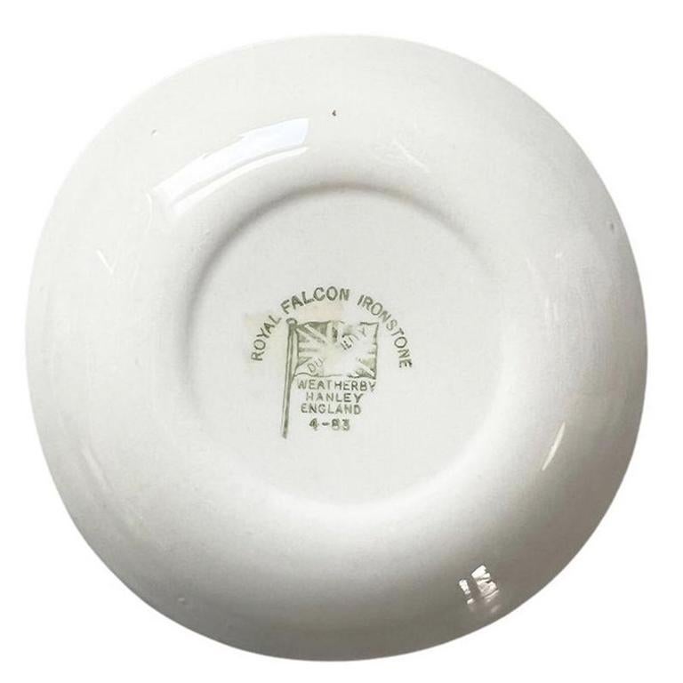 A petite ceramic horse motif trinket dish by Royal Falcon Ironstone, Weatherby. This lovely decorative dish will be gorgeous on a side table, dressing table, or coffee table. The center of the dish features a brown horse with white down his nose. He