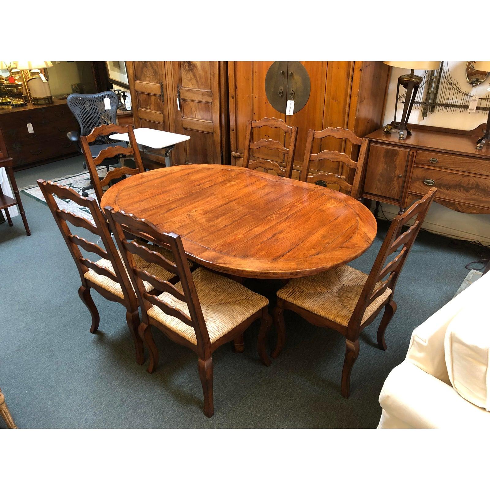 A charming dining set by Sunrise Home. The solid wood table features rustic details such as wide planks and rich wood tones. Easy expansion mechanism opens to add a pair of 12 inch leaves, changing the compact round to an oval with room enough for