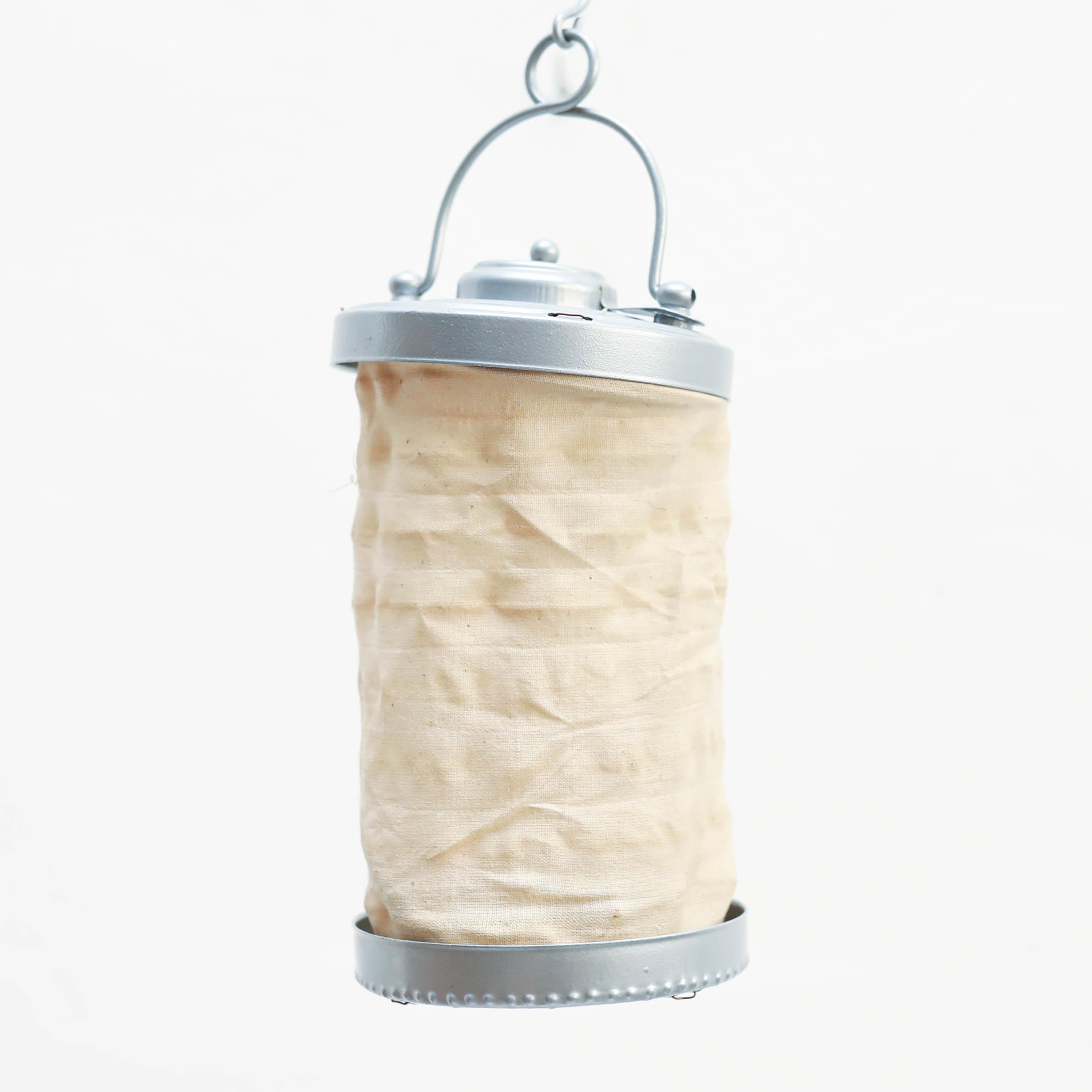 Traditional textile and metal lantern.  By unknown manufacturer from Spain, circa 1940.    In original condition, with minor wear consistent with age and use, preserving a beautiful patina.    Material:  Textile  Metal    Dimensions:  Ø 10 cm x H 25