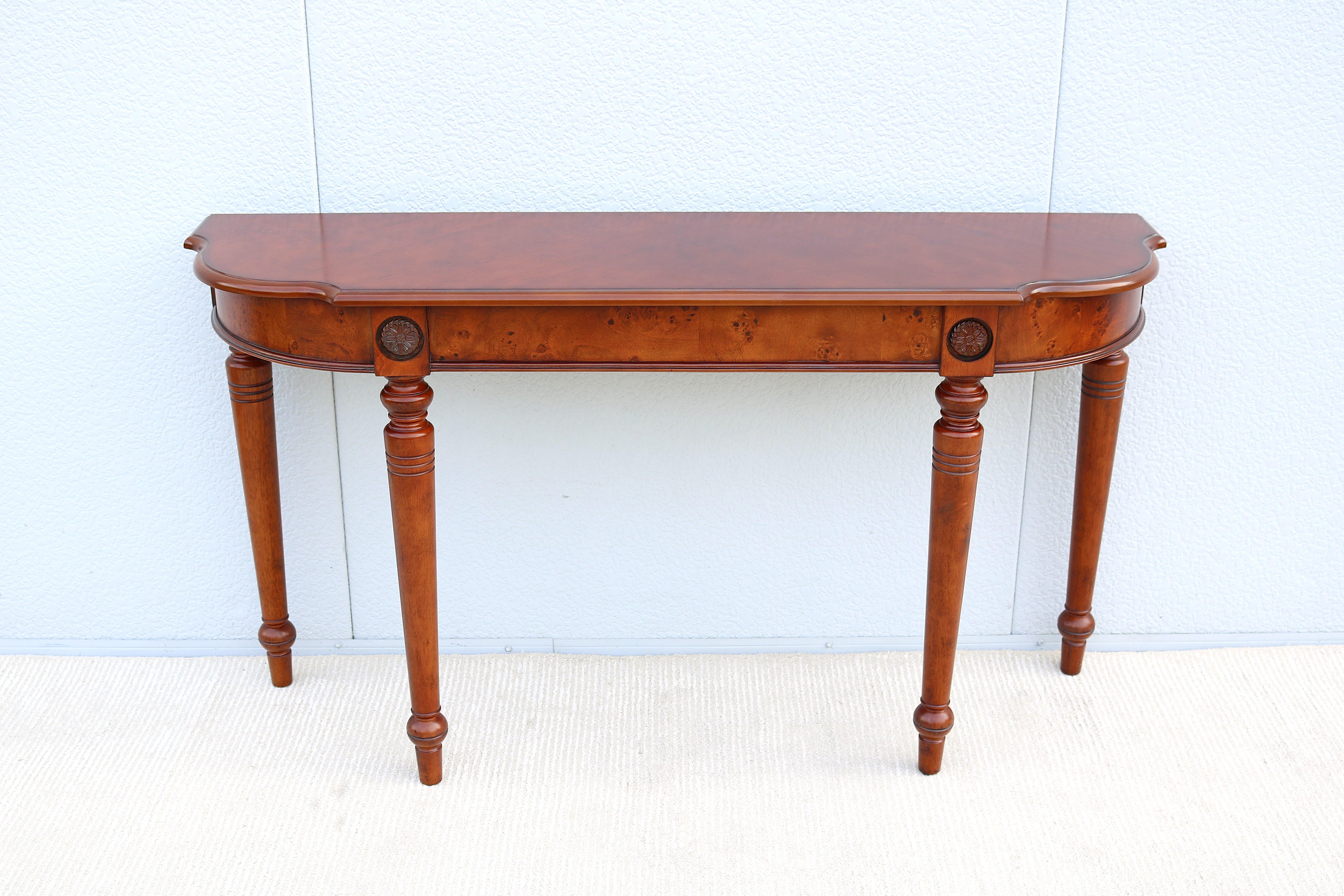 Fabulous traditional French style cherry and burl wood console sofa table.
A classic timeless and luxurious style inspired by the 18th century design.
Features a cherry and burl wood top with half serpentine sides and traditional edge detailing,
