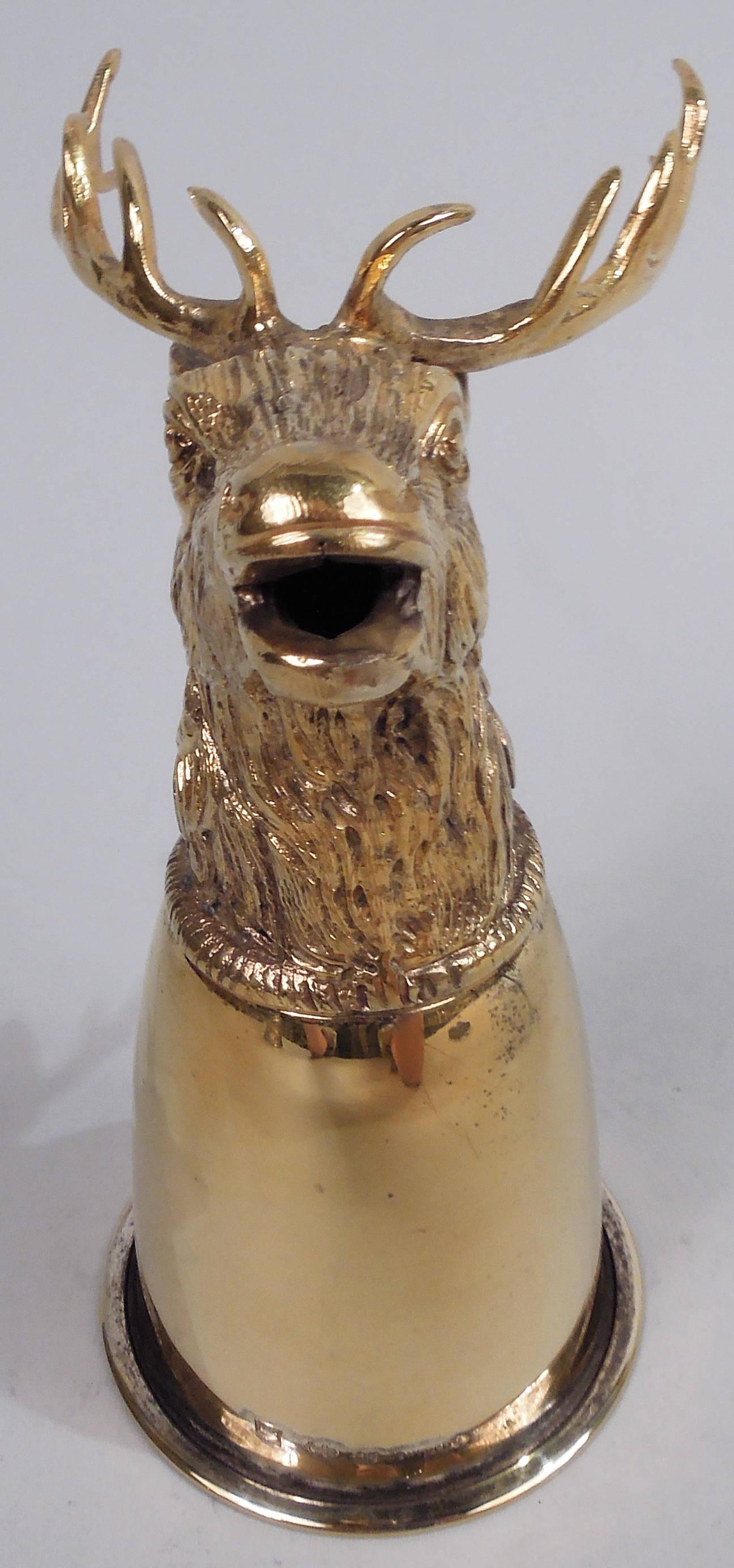 Traditional German gilt sterling silver stirrup cup, ca 1950. Conical bowl mounted with cast stag head—a furry, gaping beast with flexed-back ears and big antlers. Marked. Weight: 10.5 troy ounces.
