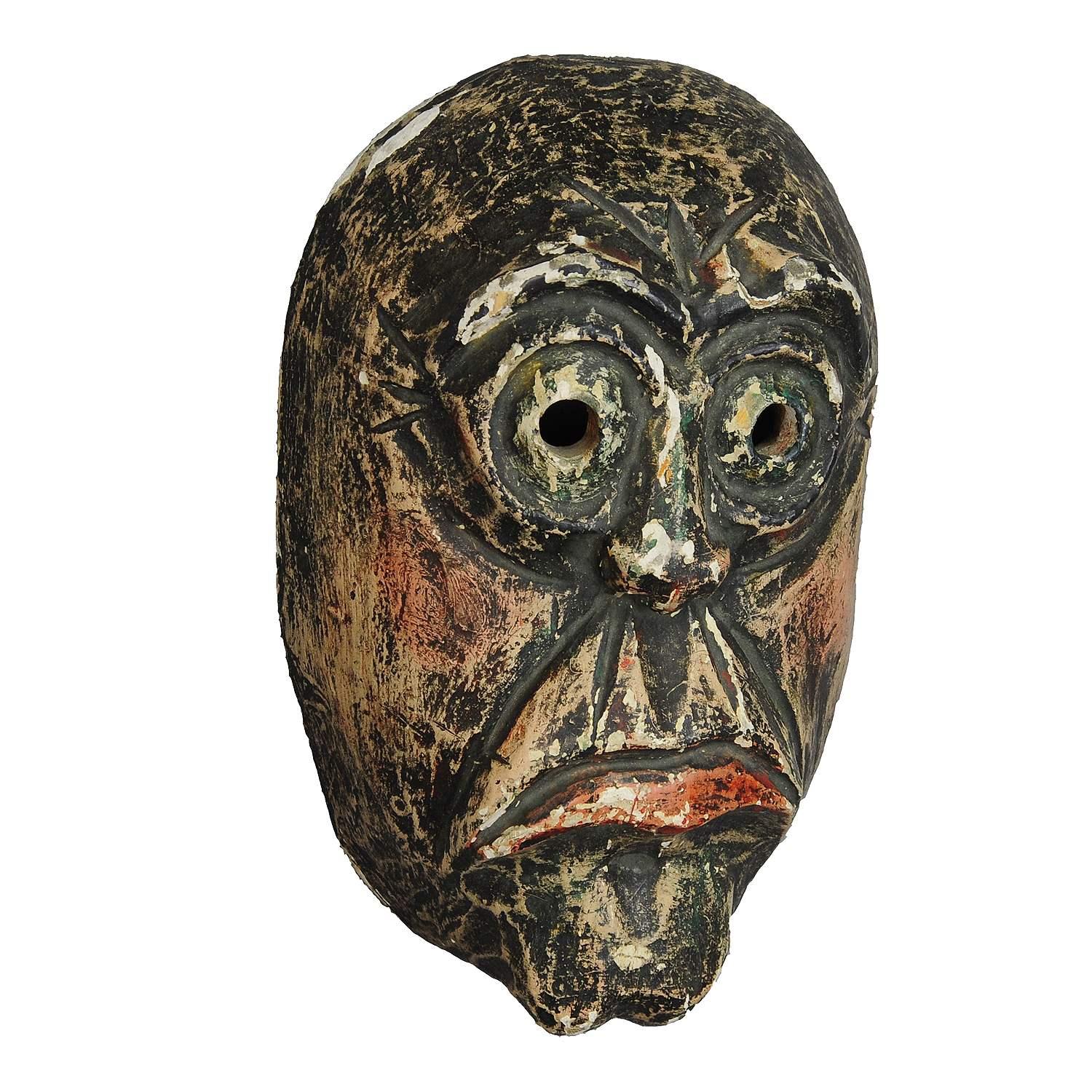Traditional handcarved and painted tyrolian carnival mask

An nice antique wooden carved carnival mask which comes from the region of South Tyrol. Made of handcarved and handpainted pine wood in the 1. half 20th. century. Until today these masks are