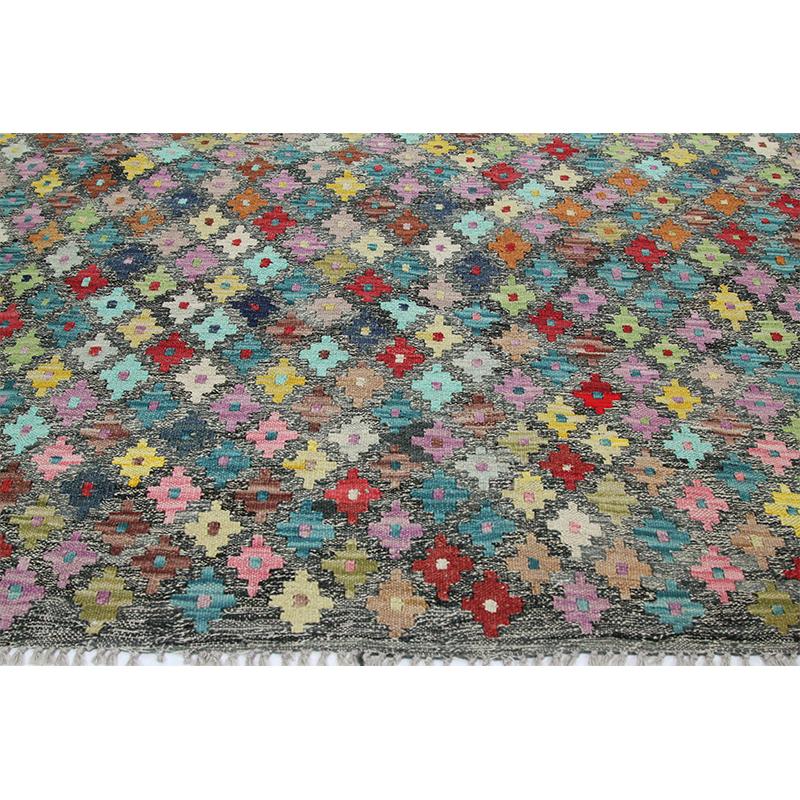 Traditional handwoven Turkish Kilim rug, this fun rug is a beautiful traditional handwoven Turkish Kilim rug featuring a diamond and geometric shape motif in a multicolored design. The lightweight construction makes this rug an excellent choice for