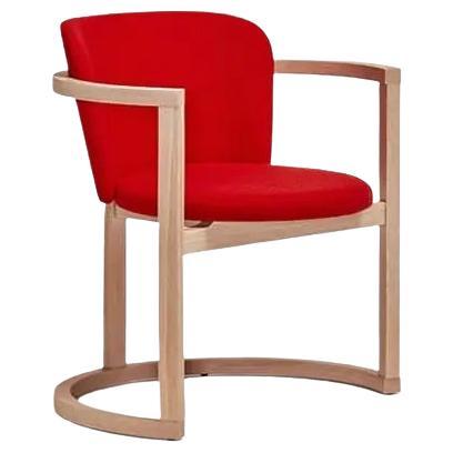 Stir is a collection of armchairs in beech plywood with a curved chair back and soft fabric upholstery, featuring a base that has been designed to rock the chair gently and cradle whoever is sitting in it. A rocking chair? 