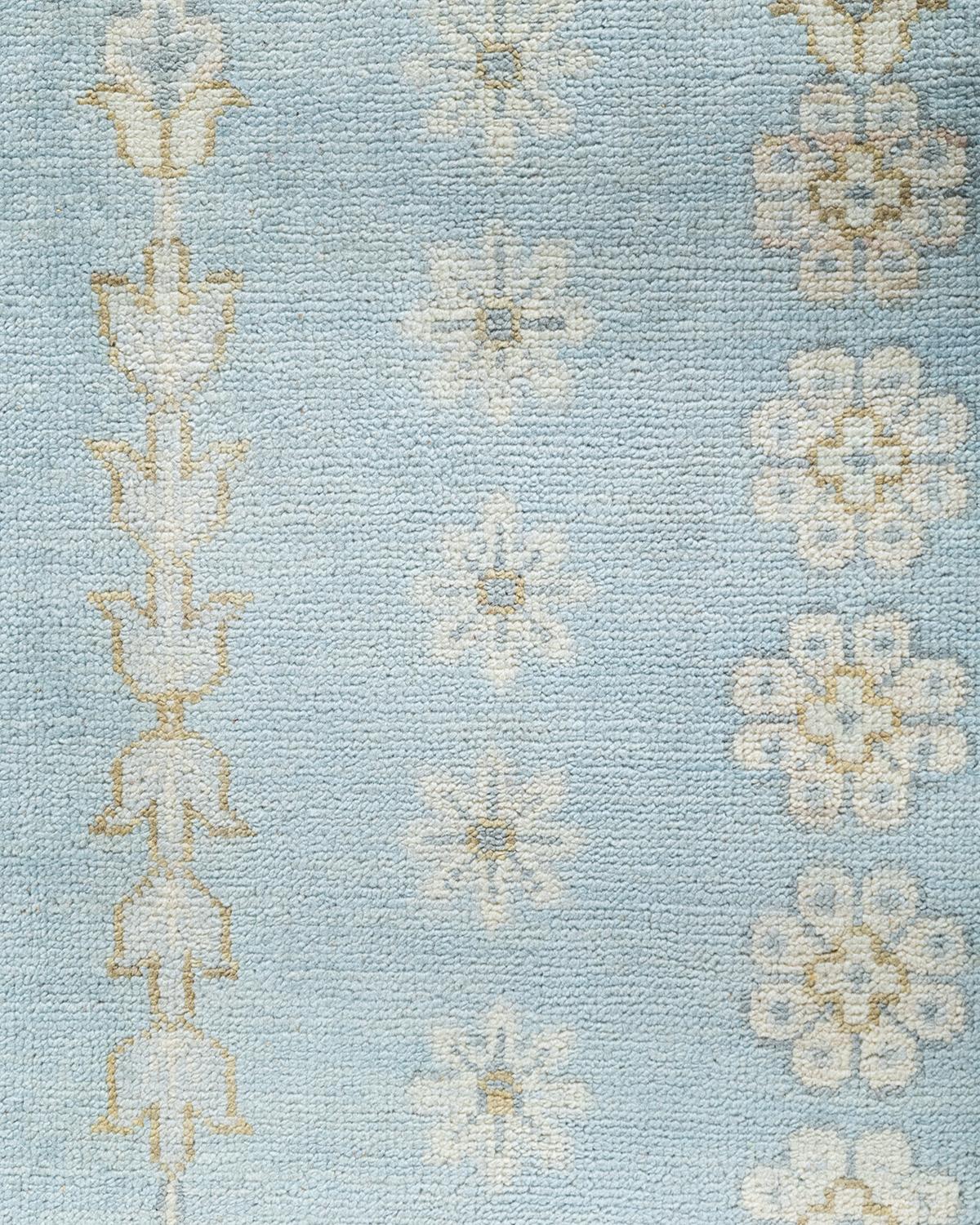 Traditioneller handgeknüpfter, geblümter Khotan-Teppich aus Wolle in Blau 9' 1