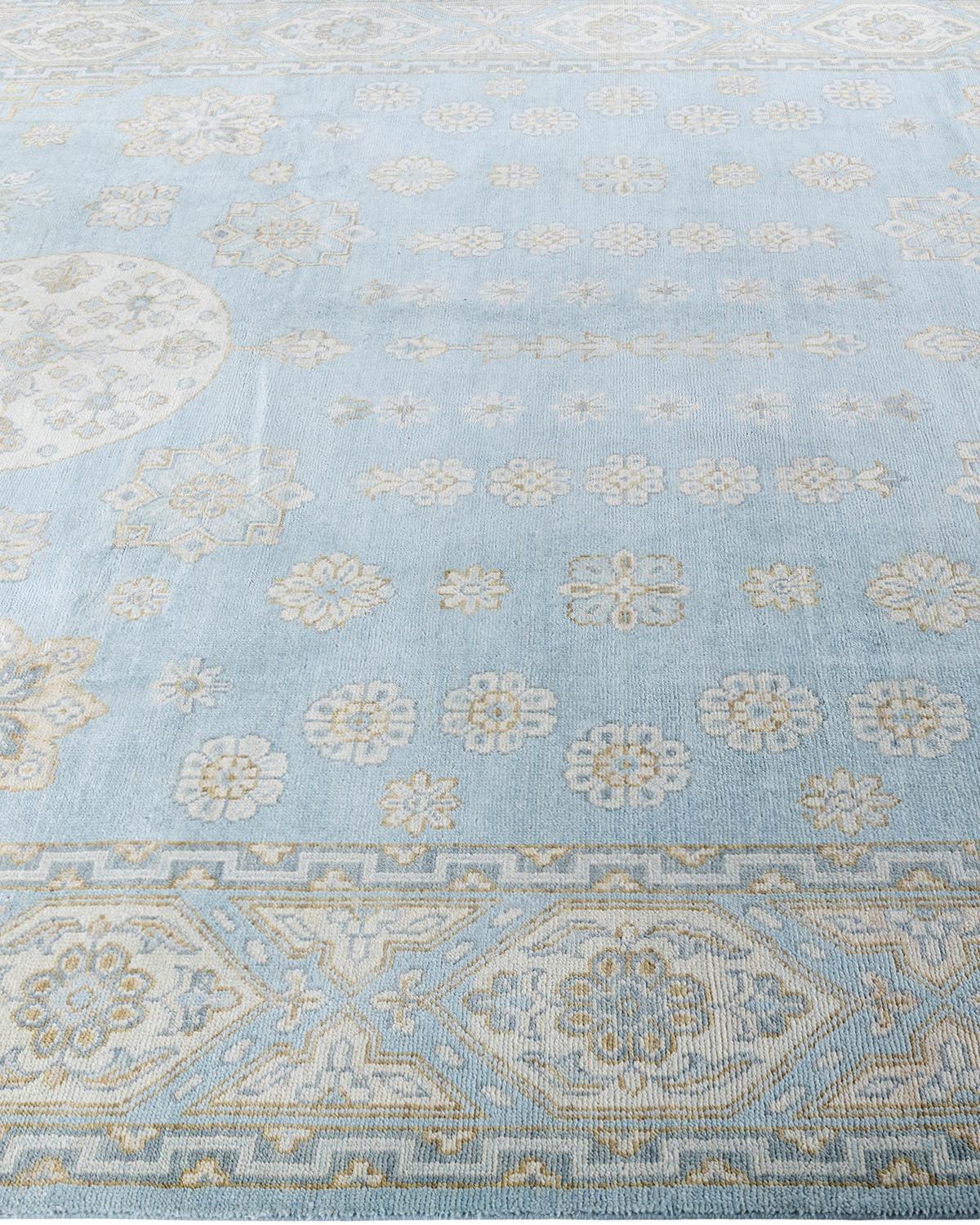 Traditioneller handgeknüpfter, geblümter Khotan-Teppich aus Wolle in Blau 9' 1