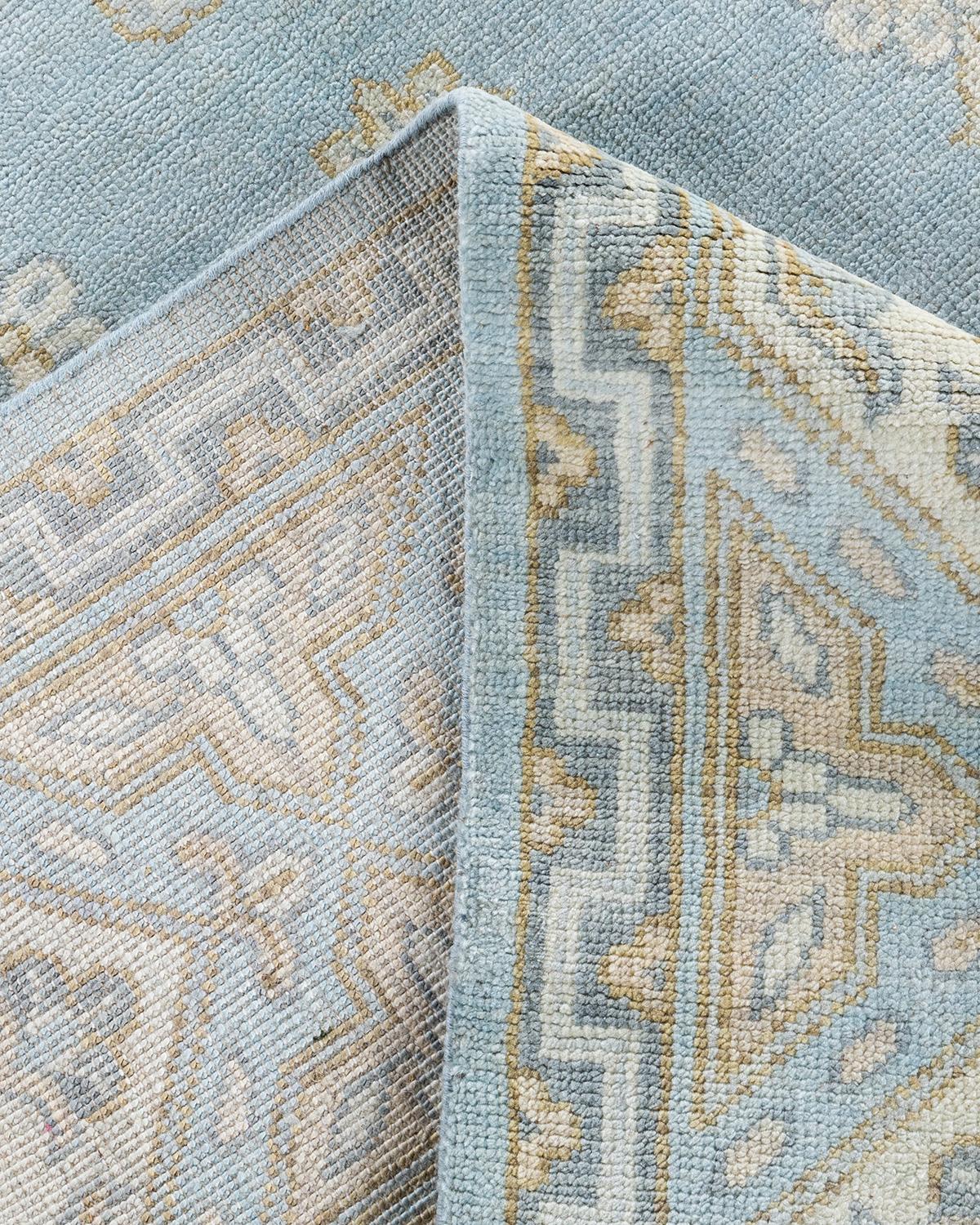 Traditioneller handgeknüpfter, geblümter Khotan-Teppich aus Wolle in Blau 9' 1