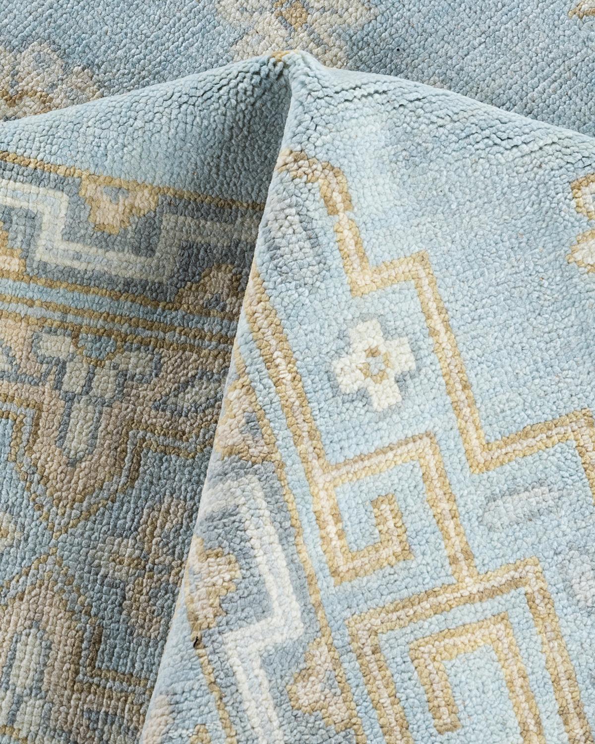Traditioneller handgeknüpfter, geblümter Khotan-Teppich aus Wolle in Blau 9' 1