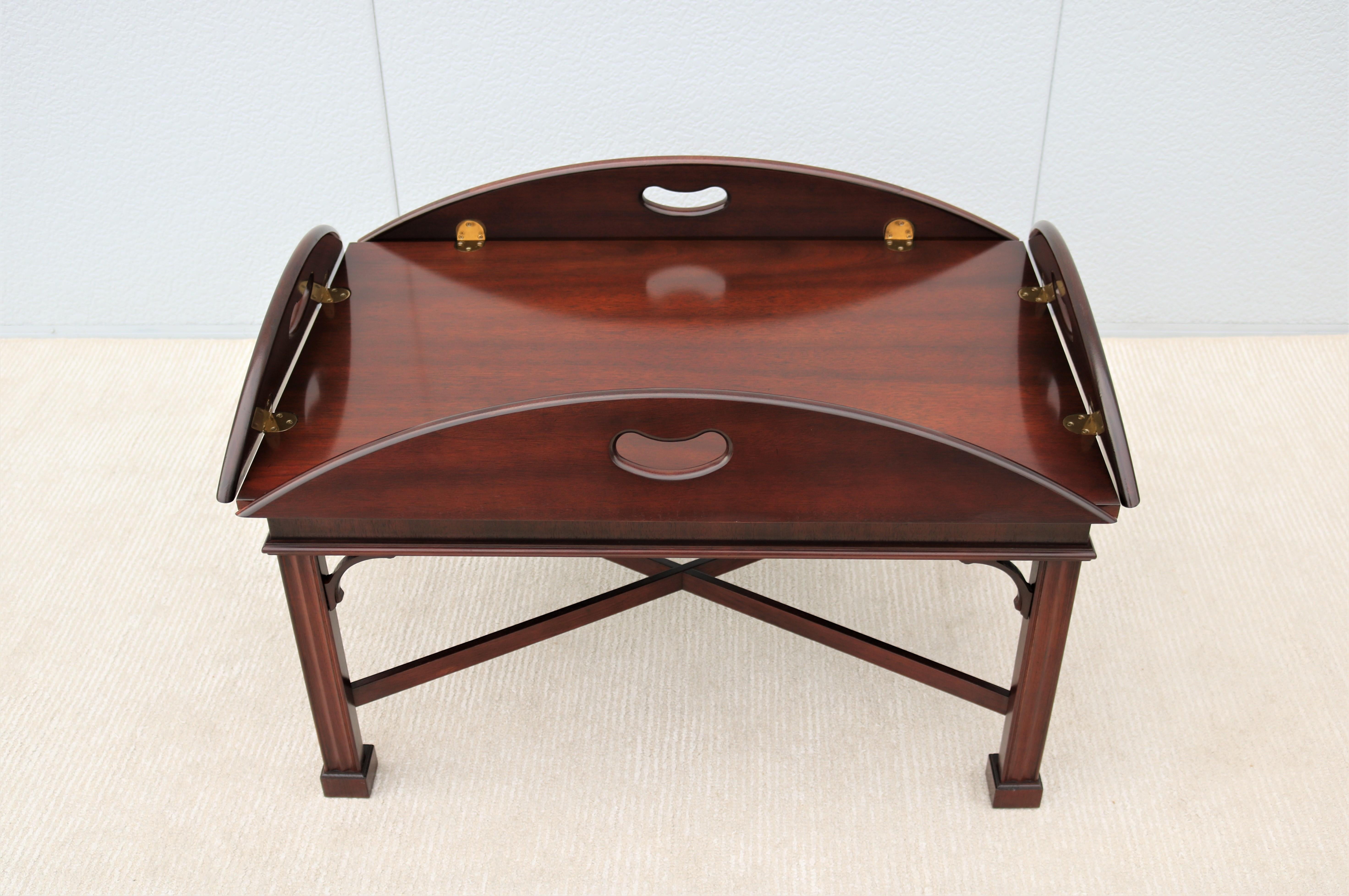 Fabulous traditional Kimball mahogany drop-leaf butler tray coffee table.
Generation after generation chooses this style of table for elegance and function.
Feature four hinged lift-up pierced handholds leaves with bright solid brass