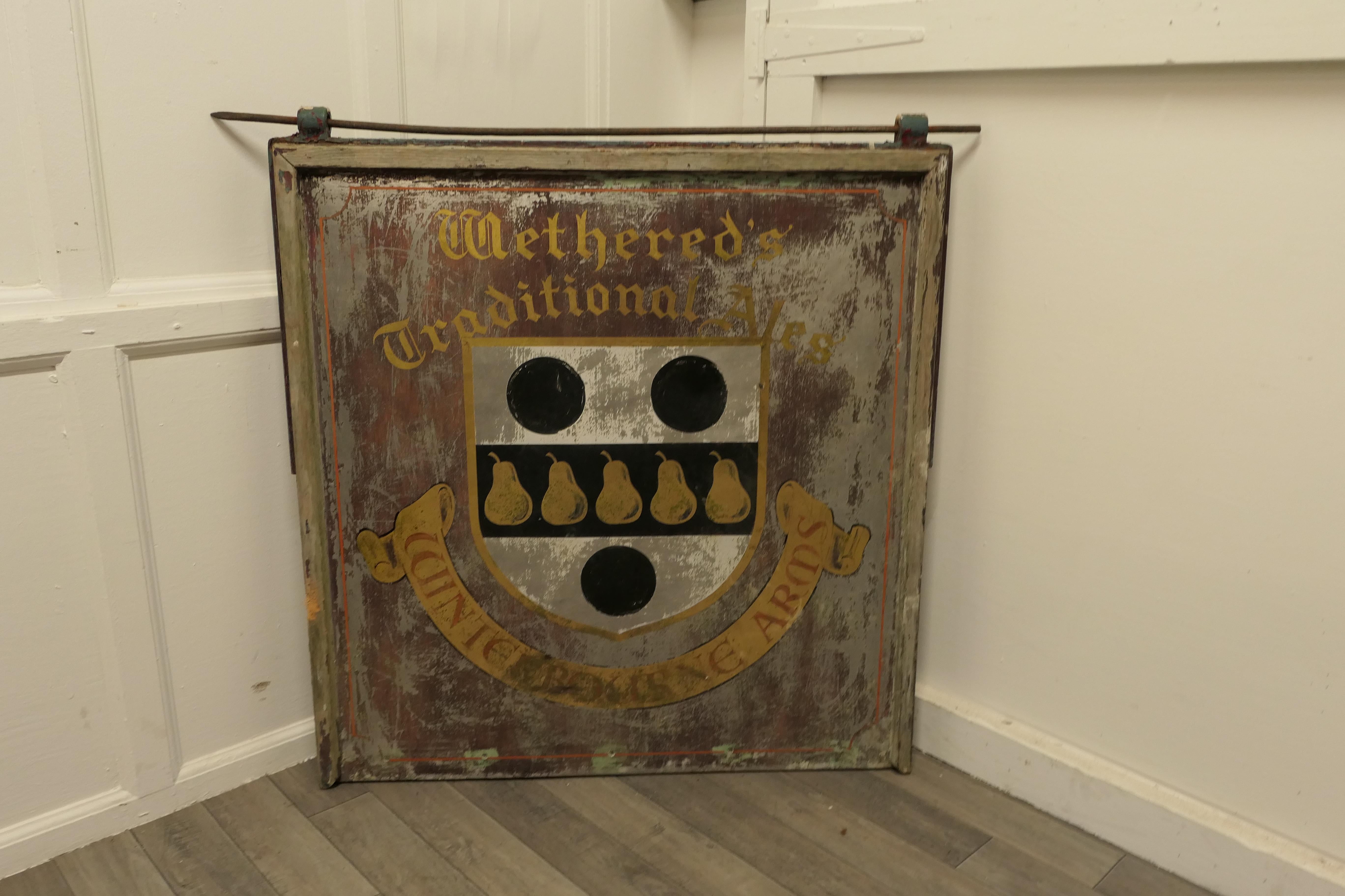 Traditional large hanging pub sign. Wethered’s winterbourne arms

This is a large and heavy piece dating from the first half of the 20th Century, it is double sided though the paint on one side is rather worn, it has fixings on the top of the