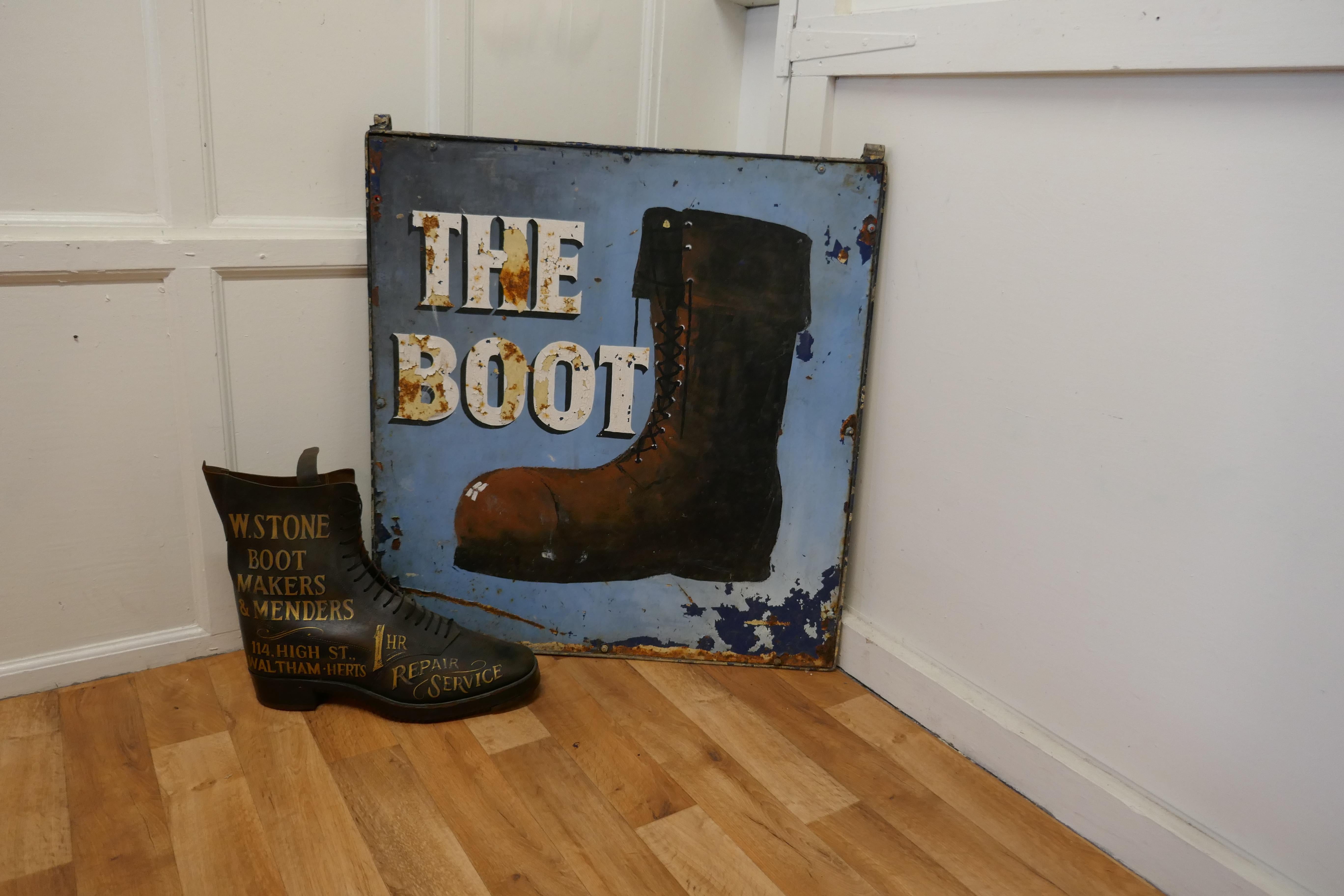 Traditional large iron hanging pub sign. The Boot

This is a large and heavy piece dating from the beginning of the 20th Century, it is double sided though the paint on one side is very worn, it has fixings and would have been suspended from a