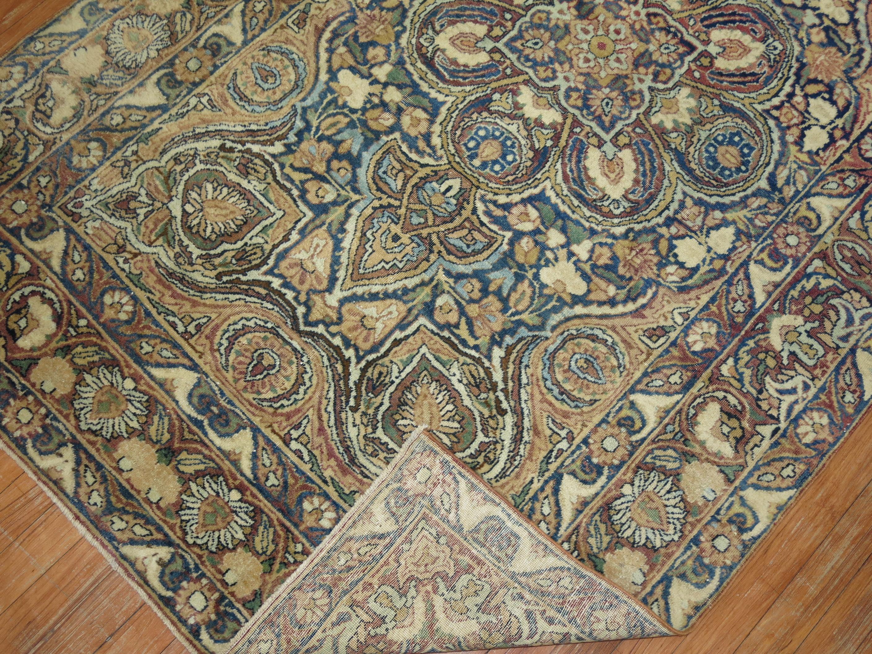 An early 20th century Persian Lavar Kerman traditional rug. Accents in wine, blue, green and brown

Measures: 4'1