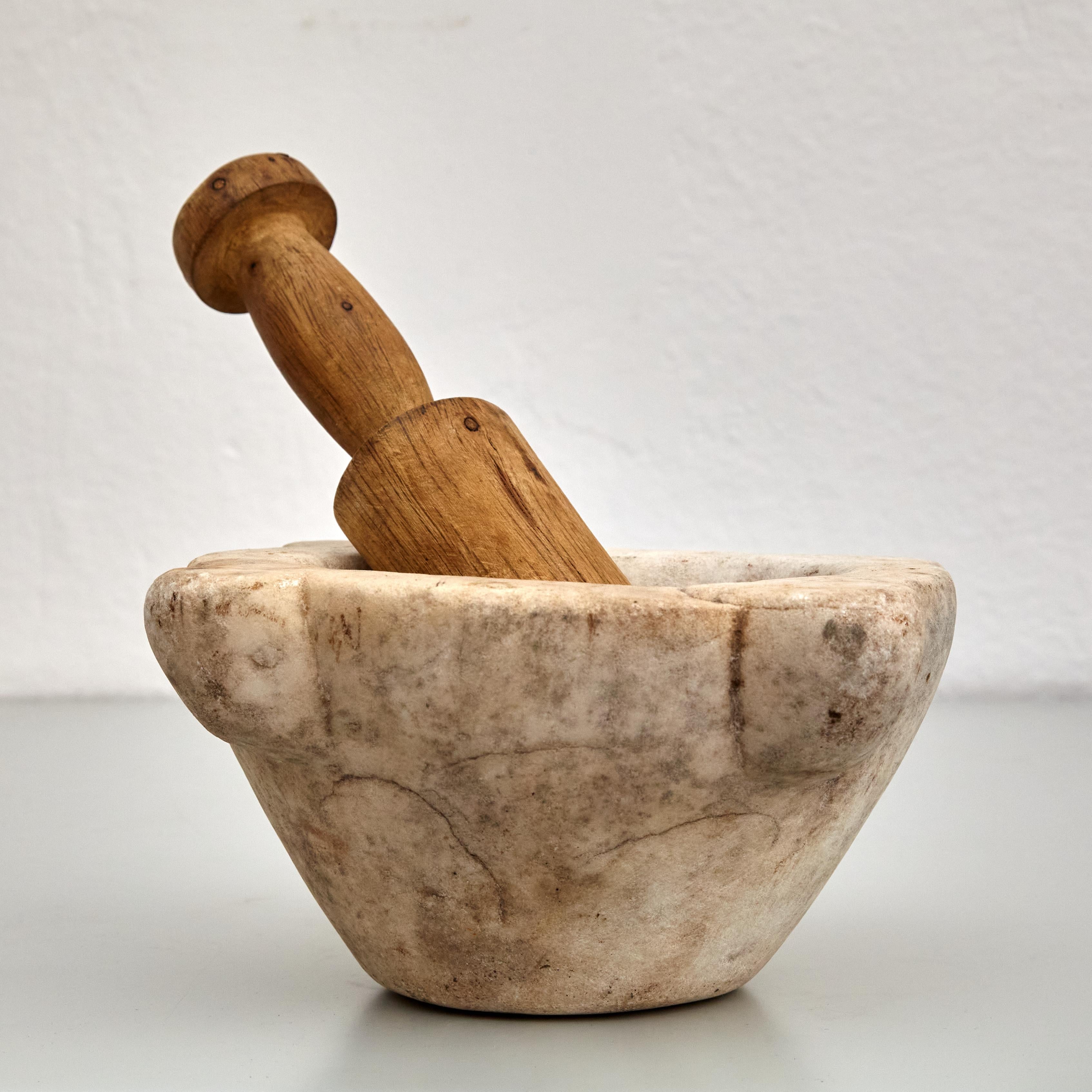 Traditional Mid-Century Modern Spanish Mortar.

Manufactured in Spain, circa 1940.

In original condition with minor wear consistent of age and use, preserving a beautiful patina.

Materials: 
Stone, wood 

Dimensions: 
Diam 26 cm x H 11.5