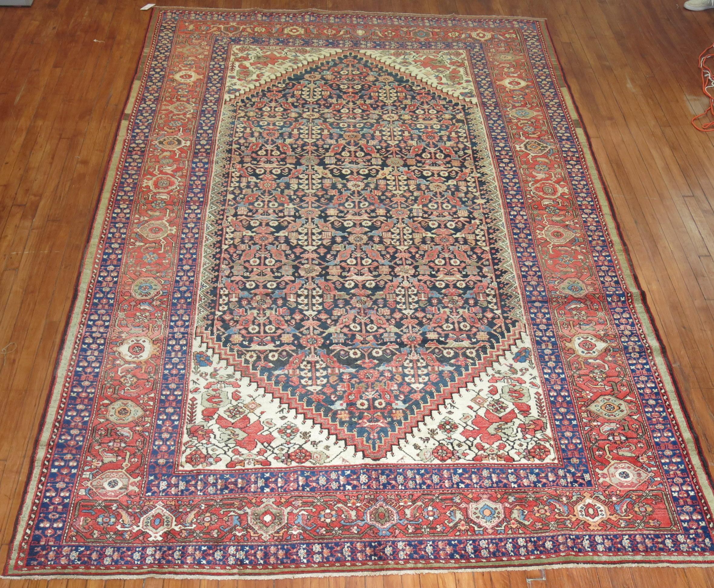 Room size Persian Malayer rug with an all-over repetitive tribal design on a navy ground. 

Measures: 7'11'' x 12'5''.

  