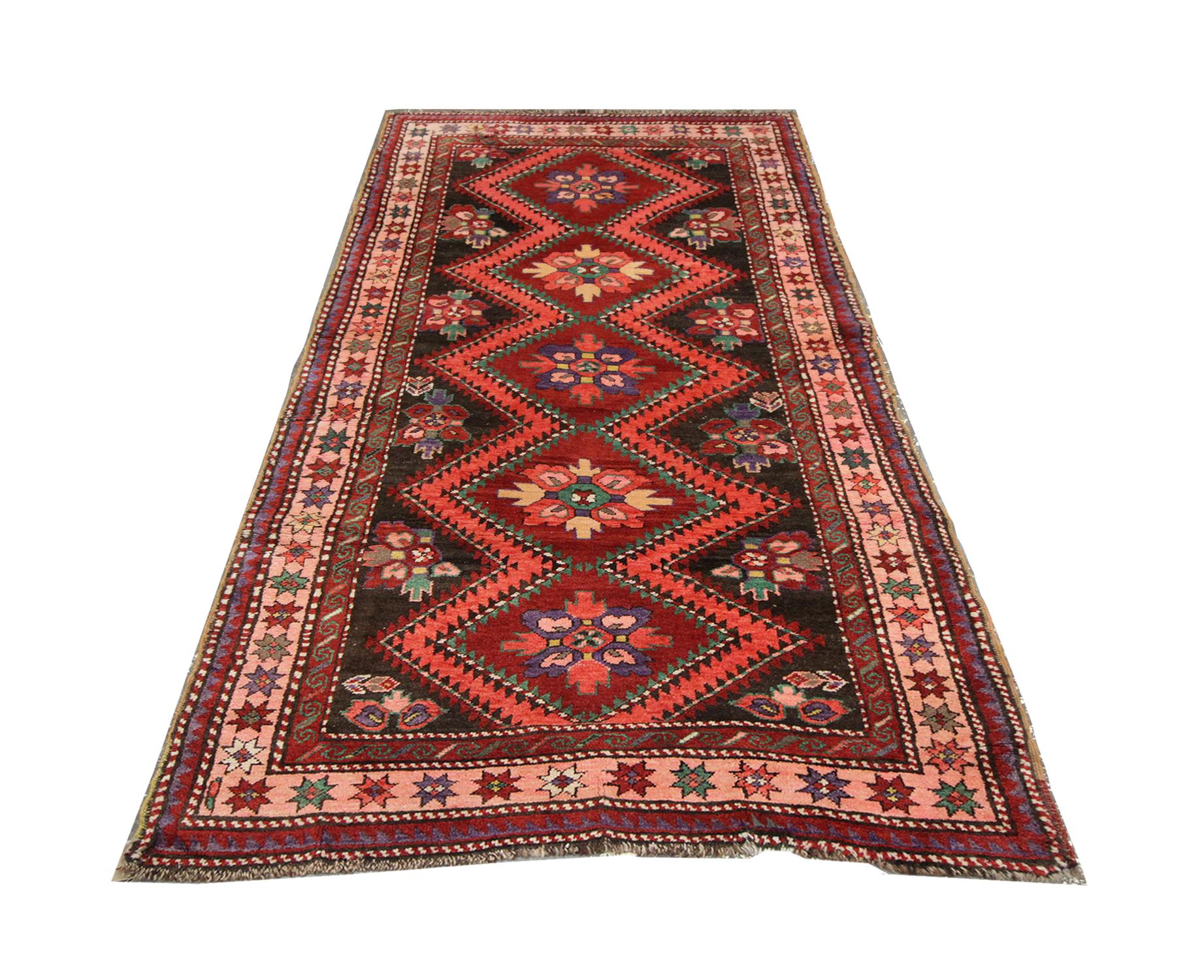 Handmade carpet Oriental rug pairing deep tones of orange and red this stunning antique rug has been handwoven to perfection. The centrepiece is a beautiful diamond, repeat pattern on a deep red background, the contrast in colors works beautifully