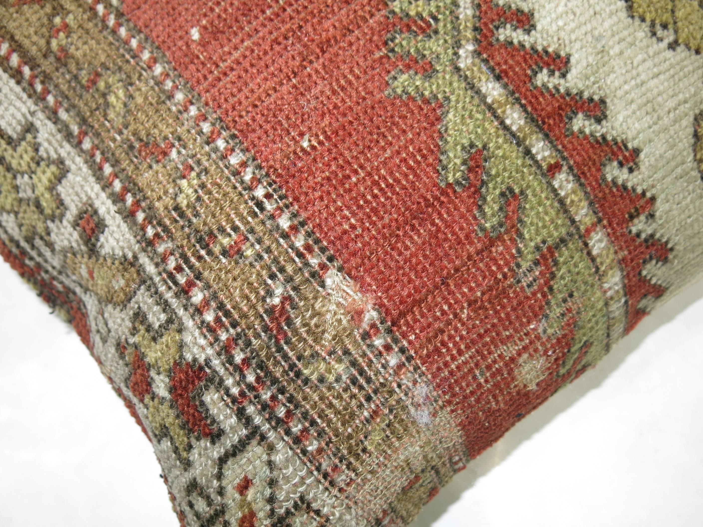 One of a kind rug pillow made from a vintage Turkish Oushak with cotton back and zipper closure.

15'' x 18''
    