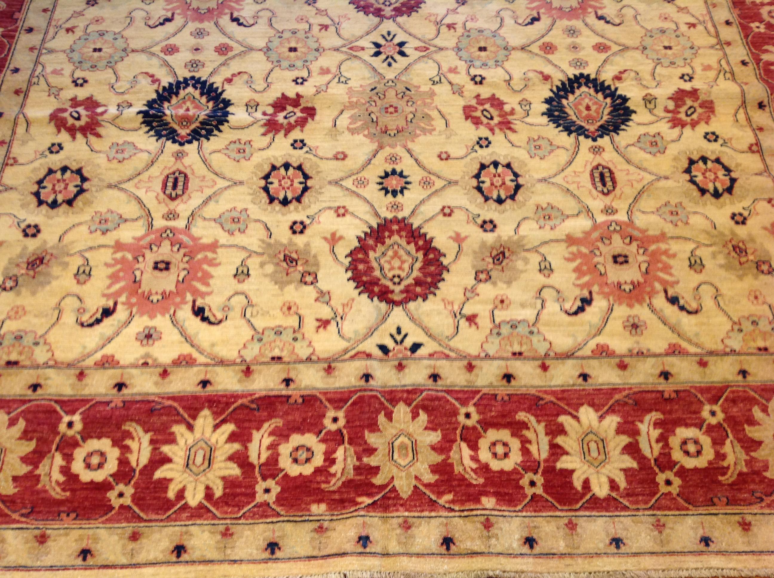 Wool Traditional Pakistani Beige Floral Rug with Red and Teal For Sale