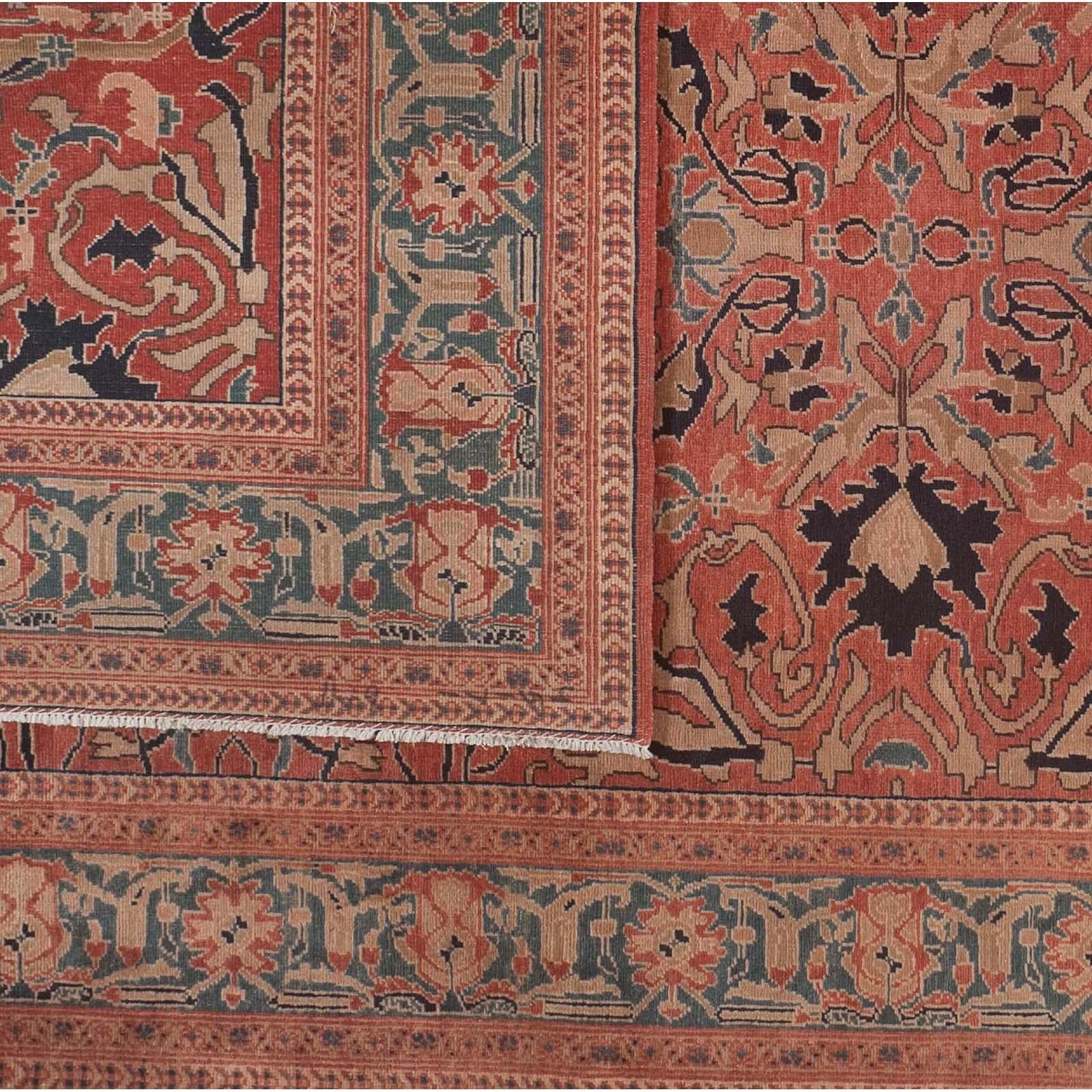 Red and teal dominate in this Pakistan-made traditional area rug. The elaborate and expertly executed design also includes black, taupe, tan and beige. The non-traditional size - 6' x 11' - also make this rug a good choice for a narrower space that