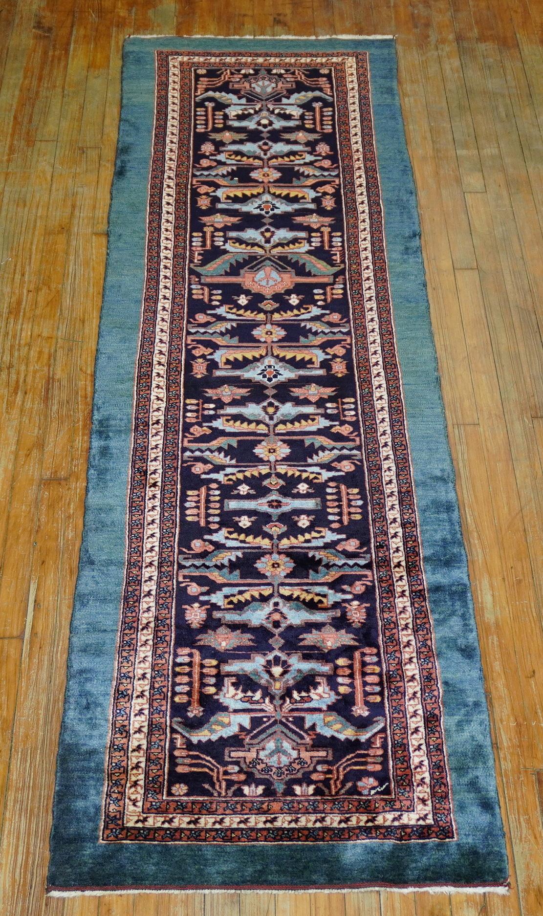 Late 20th century 100% vegetable Dyed Persian Kashkuli runner featuring an odd teal outer border resembling Persian tribal serab and Persian bakshaish rugs

Measures: 2'6'' x 8'11''.
