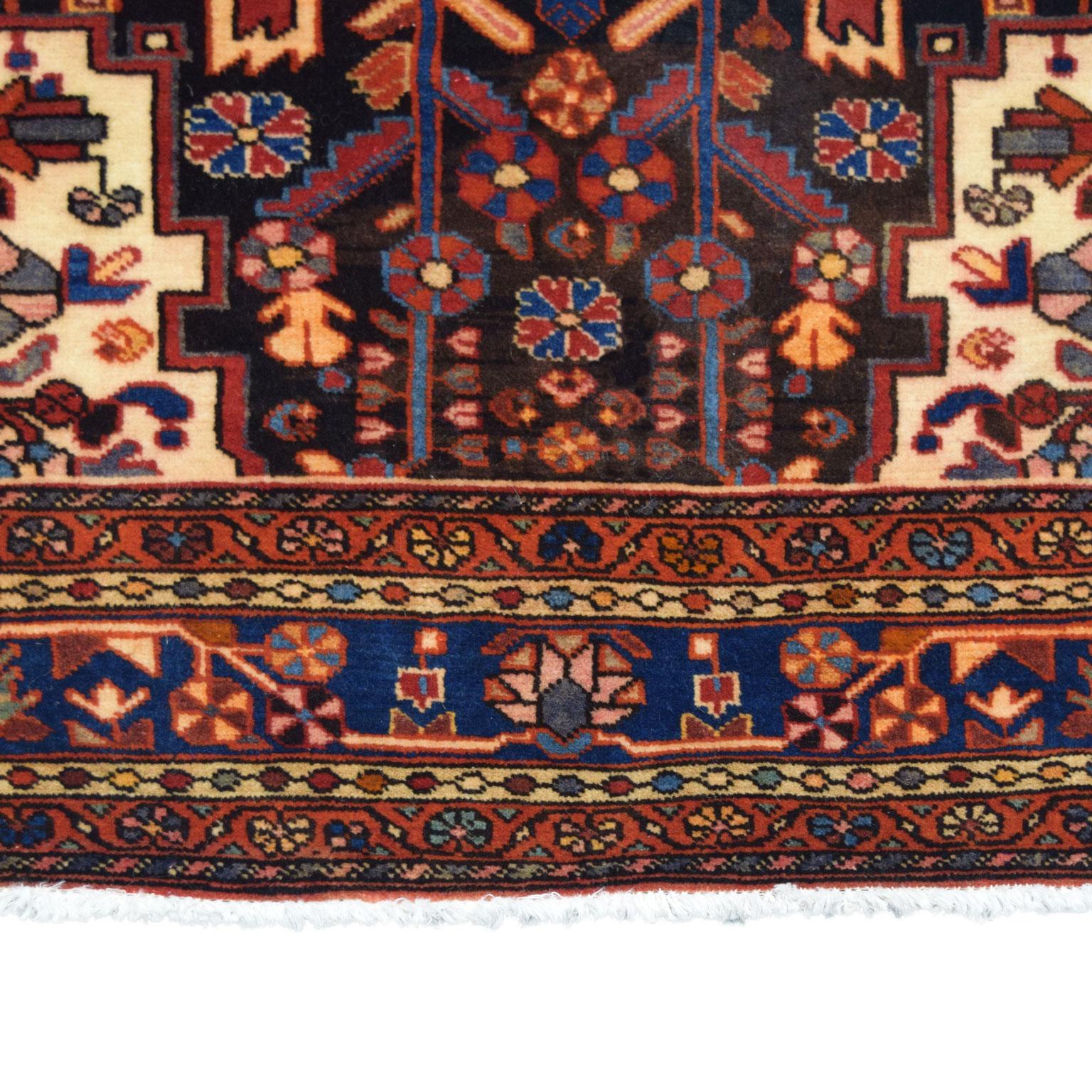 Woven in the Hamadan province of Iran, this traditional Persian carpet is hand-knotted and belongs to Orley Shabahang’s World Market Collection. The hand-knotted construction produces a pile that is soft and plush and a functional and durable