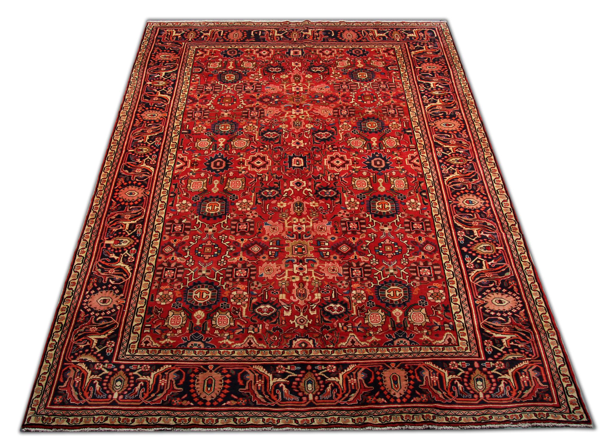 Looking to upgrade your floors with an Antique Rug? This piece is sure to wow your guests…
This fine wool rug was woven by hand in the 1920s and features a bold all-over central design with a decorative enclosing border. Woven on a rich red