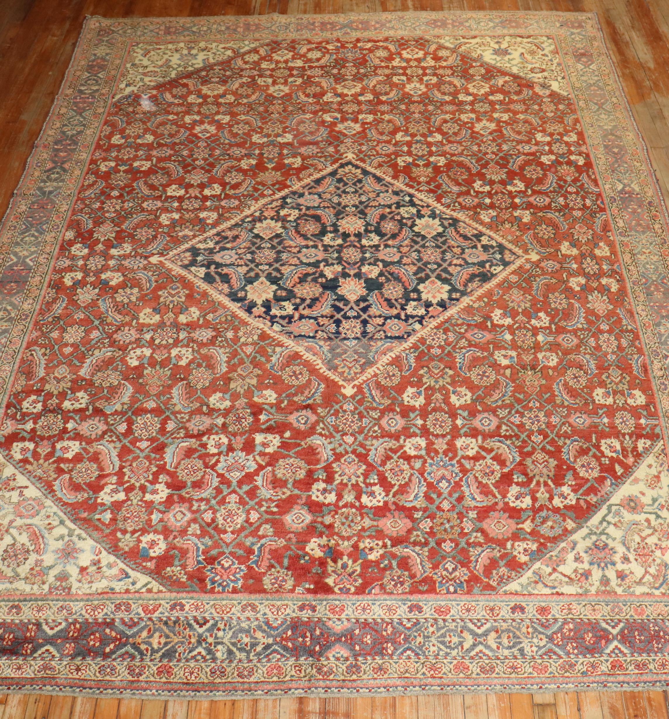 Persian Mahal room size rug with Classic diamond shape medallion and border at a great value. Full pile condition throughout. Red field, accents in ivory, blue, pink and gray. Cant argue with the Price and Value.

Measures: 8'9'' x 12' circa 1920.